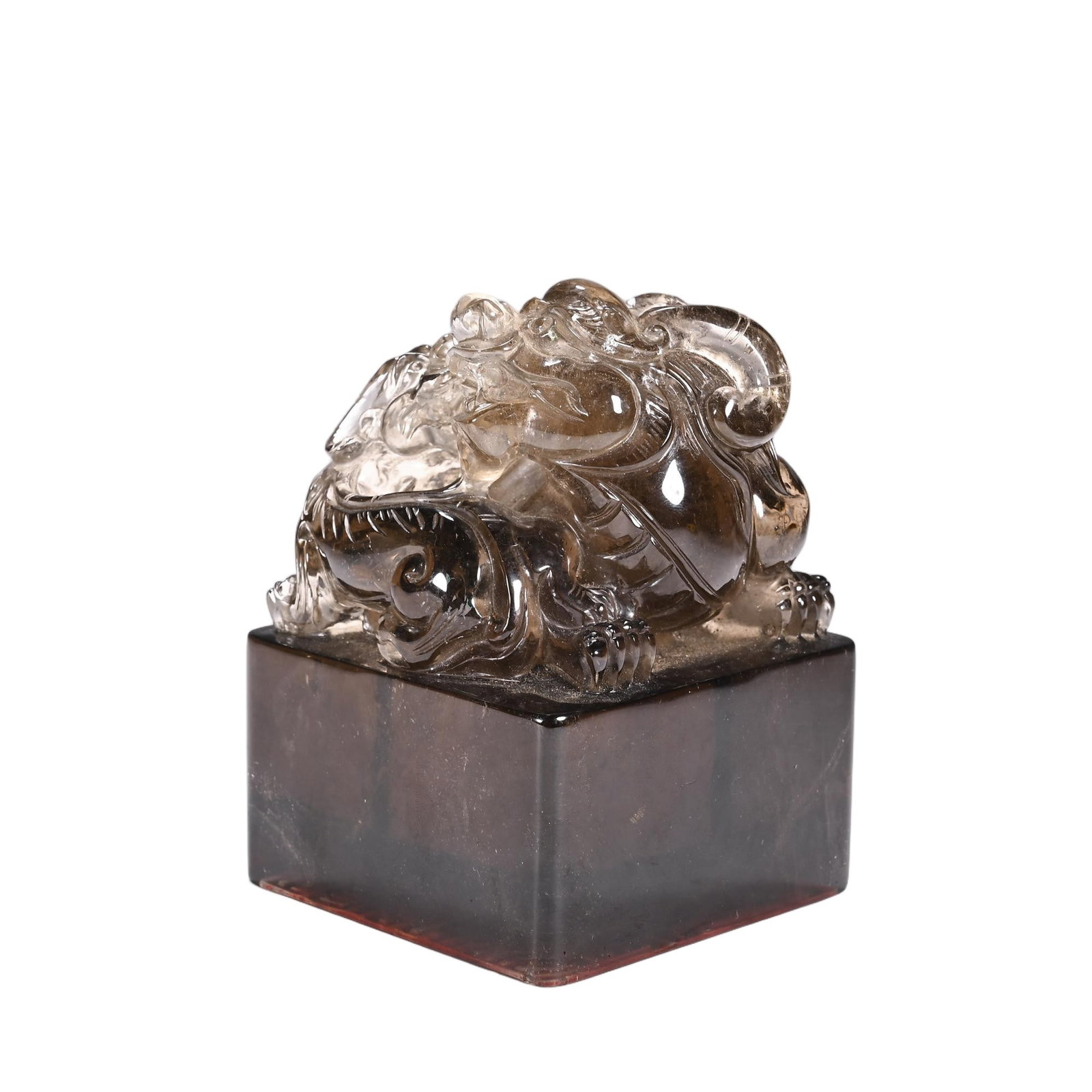 A CHINESE SMOKY CRYSTAL SEAL: Standing 12 cm in height and 8.5 cm in width, this substantial seal is hewn from rich smoky rock crystal with natural graded brown tonalities running throughout the dense square plinth. The top knob f