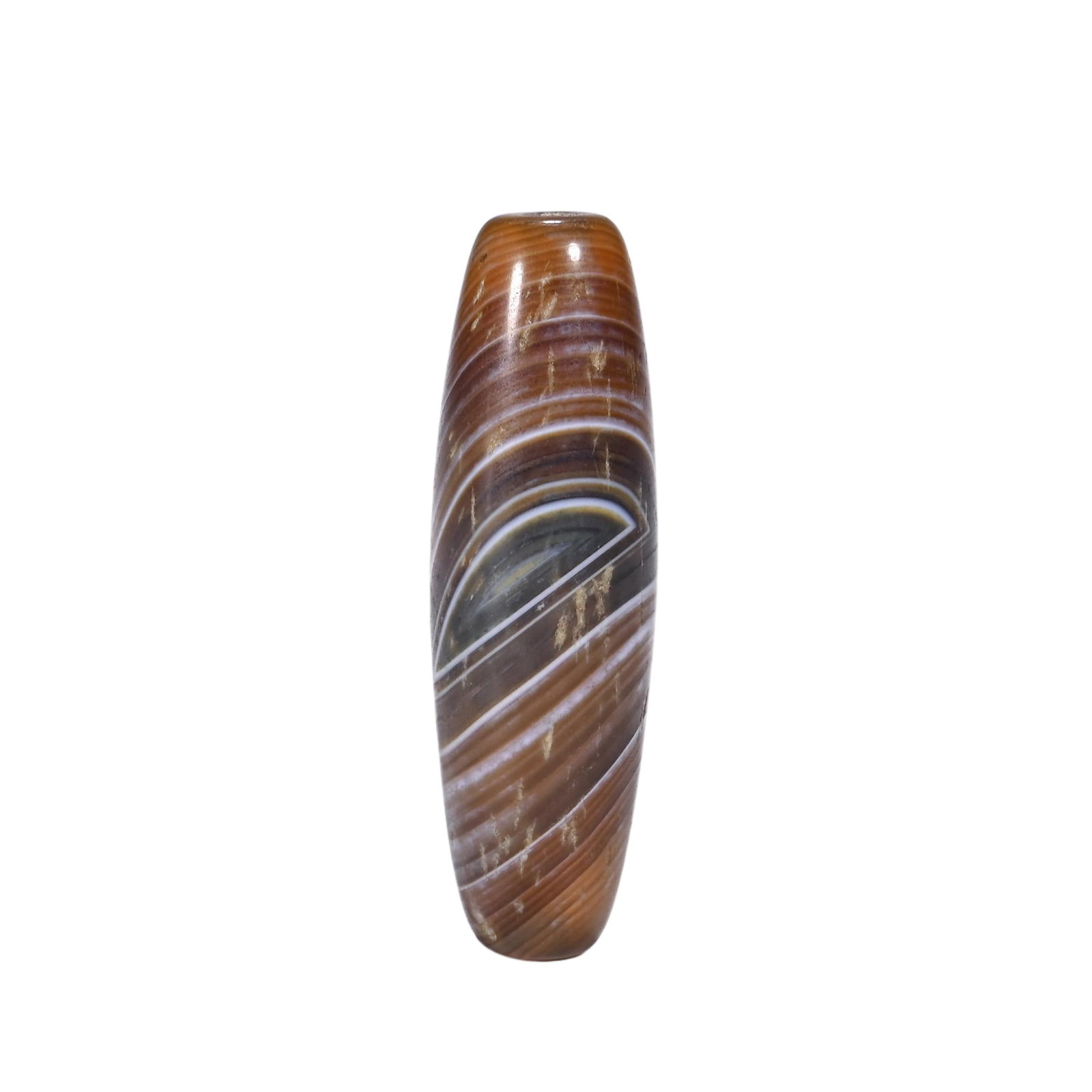 A CHINESE BANDED DZI BEAD: Stretching 4.3 cm in length, this slender elongated dzi bead is fashioned from natural banded agate. Elegant concentric striations in warm amber, muted grey and pale white spiral across its smoothly p