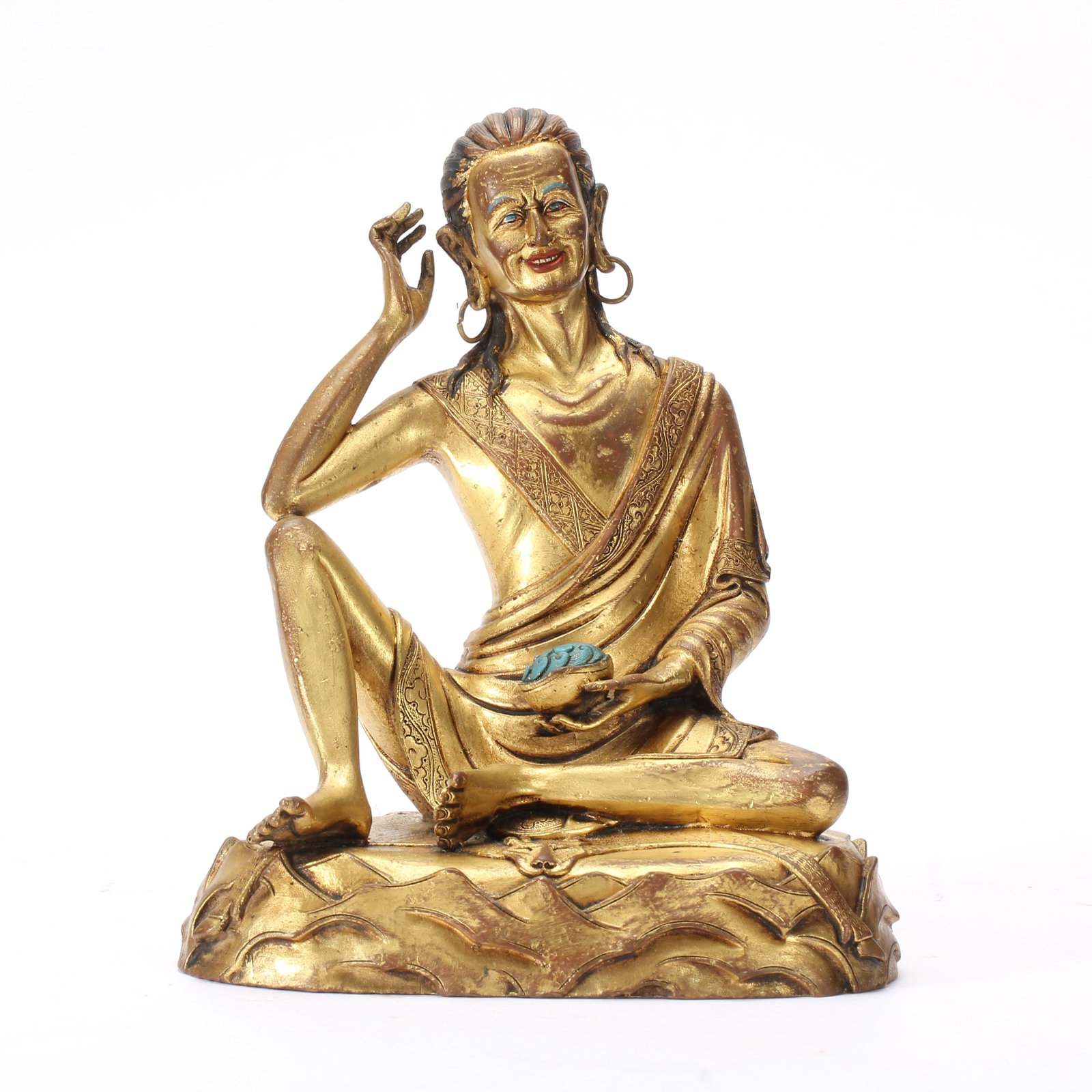 A CHINESE GILT BRONZE SAGE STATUE: Weighing 1020 grams, this finely cast gilt bronze sculpture measures 13 cm in length, 9.5 cm in width and 15 cm in height. The adept sits in a relaxed informal posture atop a textured rocky-styled pli