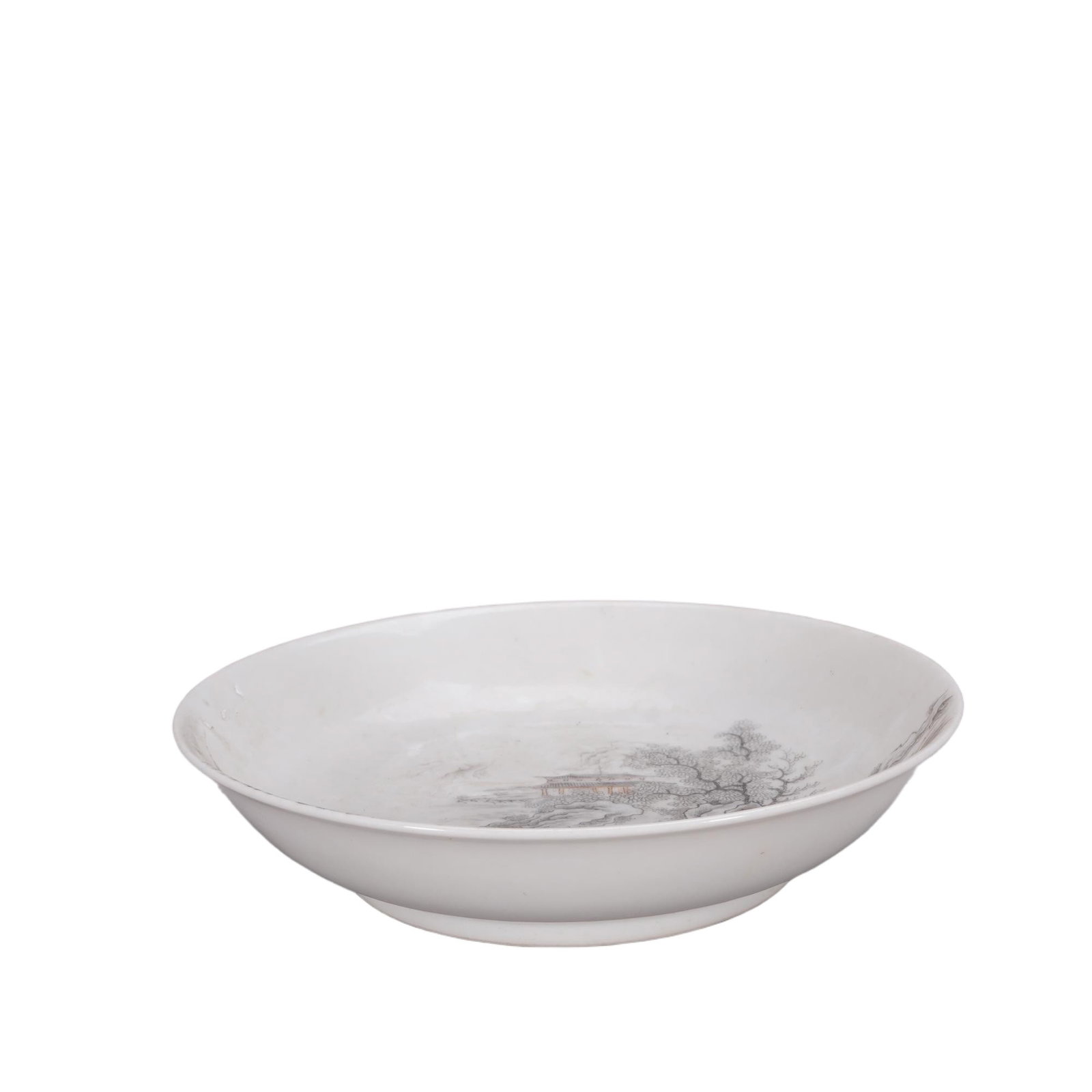 A CHINESE INK PAINTED LANDSCAPE PORCELAIN PLATE: This shallow round plate stands on a neatly formed low circular foot, finished with smooth luminous white glaze across its interior and exterior. The central well features a delicate monochrome ink la