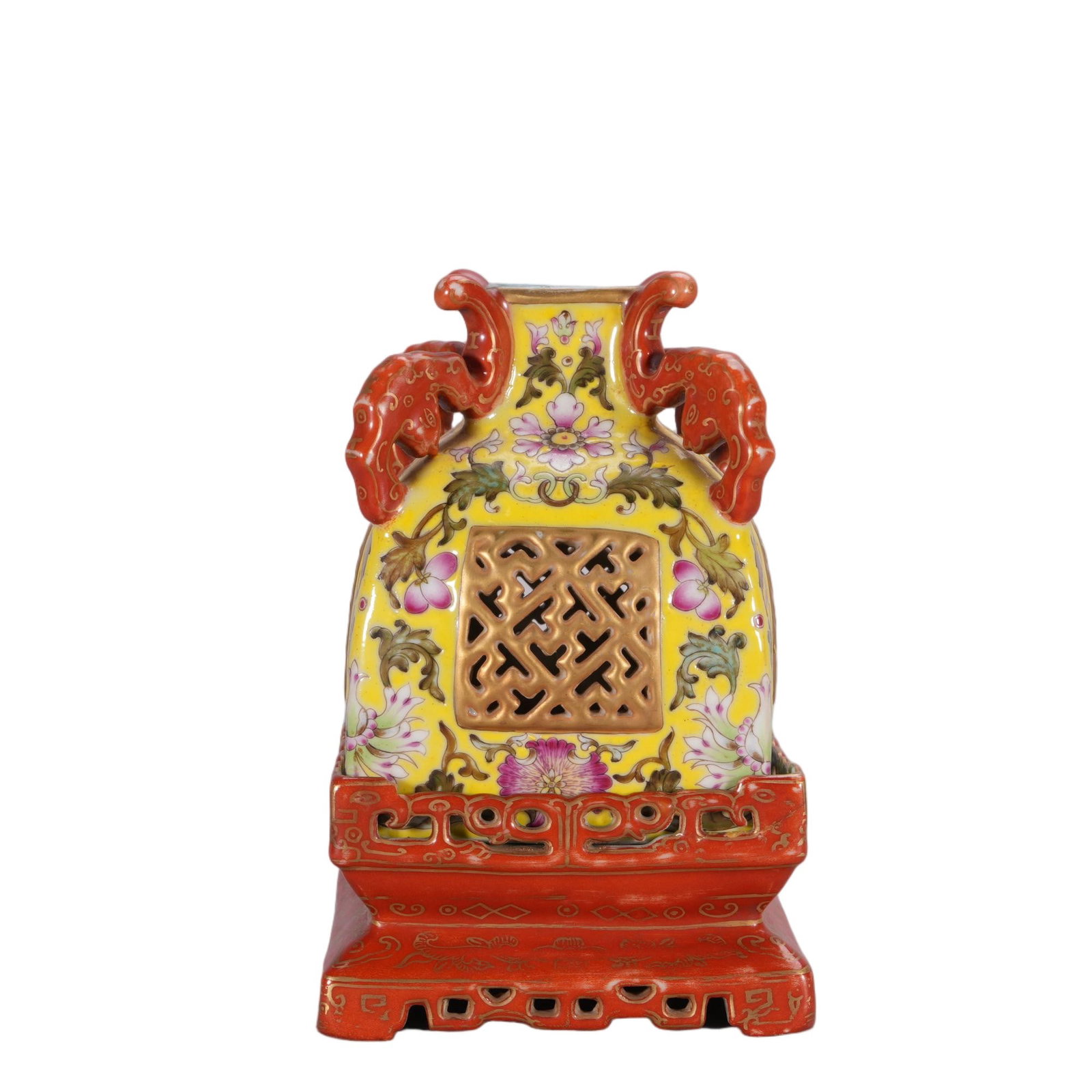 A CHINESE FAMILLE ROSE FLORAL LANTERN VASE: This lantern-form porcelain vase is fitted with twin coral-red dragon handles and integrated on a matching openwork square base outlined with fine gilded scroll patterns. Its body is glazed in vivid i
