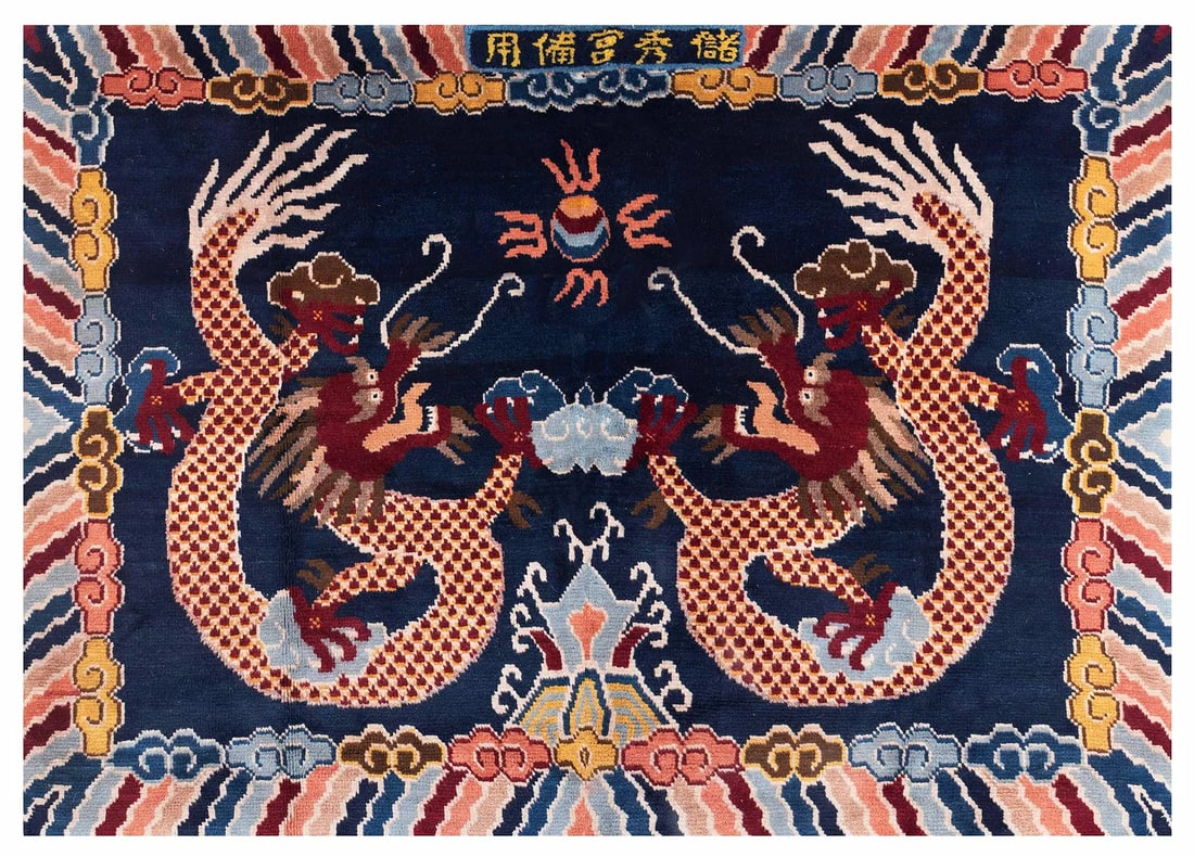 DOUBLE DRAGON BLUE WOOVEN CARPET: Dimensions: 56-3/4" H x 78" W Chinese Qing Dynasty Double Dragon Blue Wooven Rug. A finely handwoven Tibetan carpet featuring a striking pair of confronting five-clawed dragons set against a deep indi