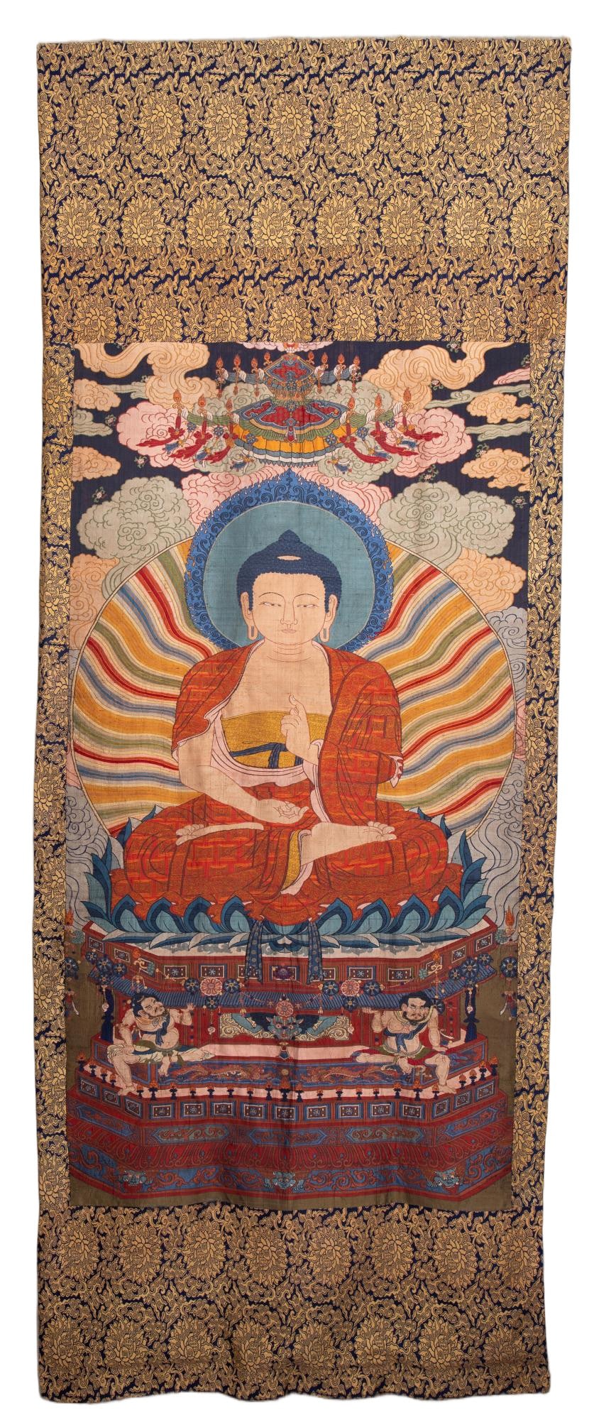 A CHINESE BROCADE BUDDHA THANGKA: Measuring 285 cm in length and 106 cm in width, this grand thangka is crafted from luxurious traditional Yunjin brocade. The central panel portrays a seated Buddha resting atop an ornate multi-tiered 