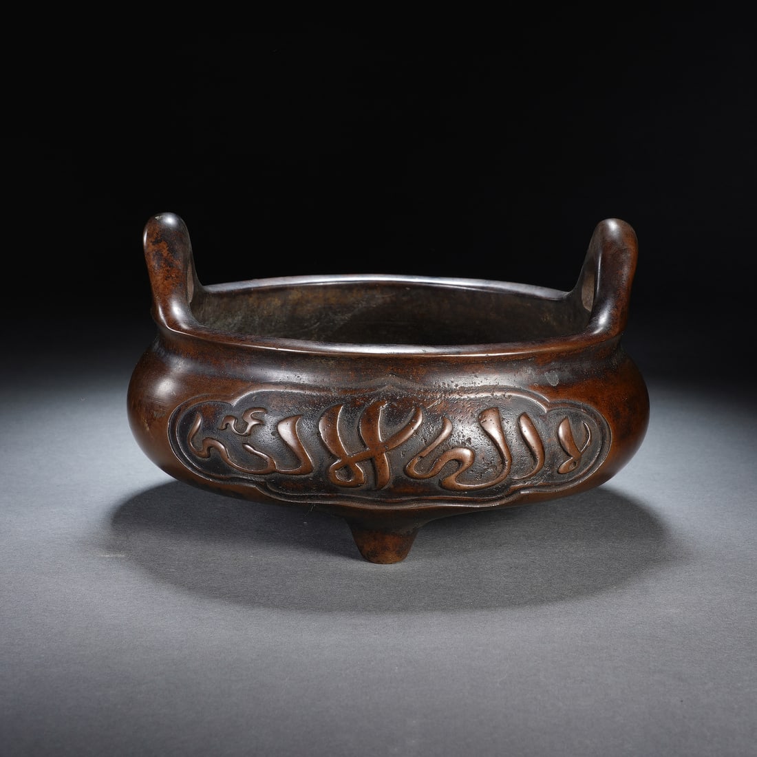 A CHINESE TRIPOD BRONZE UPRIGHT EARED CENSER (1 of 8)