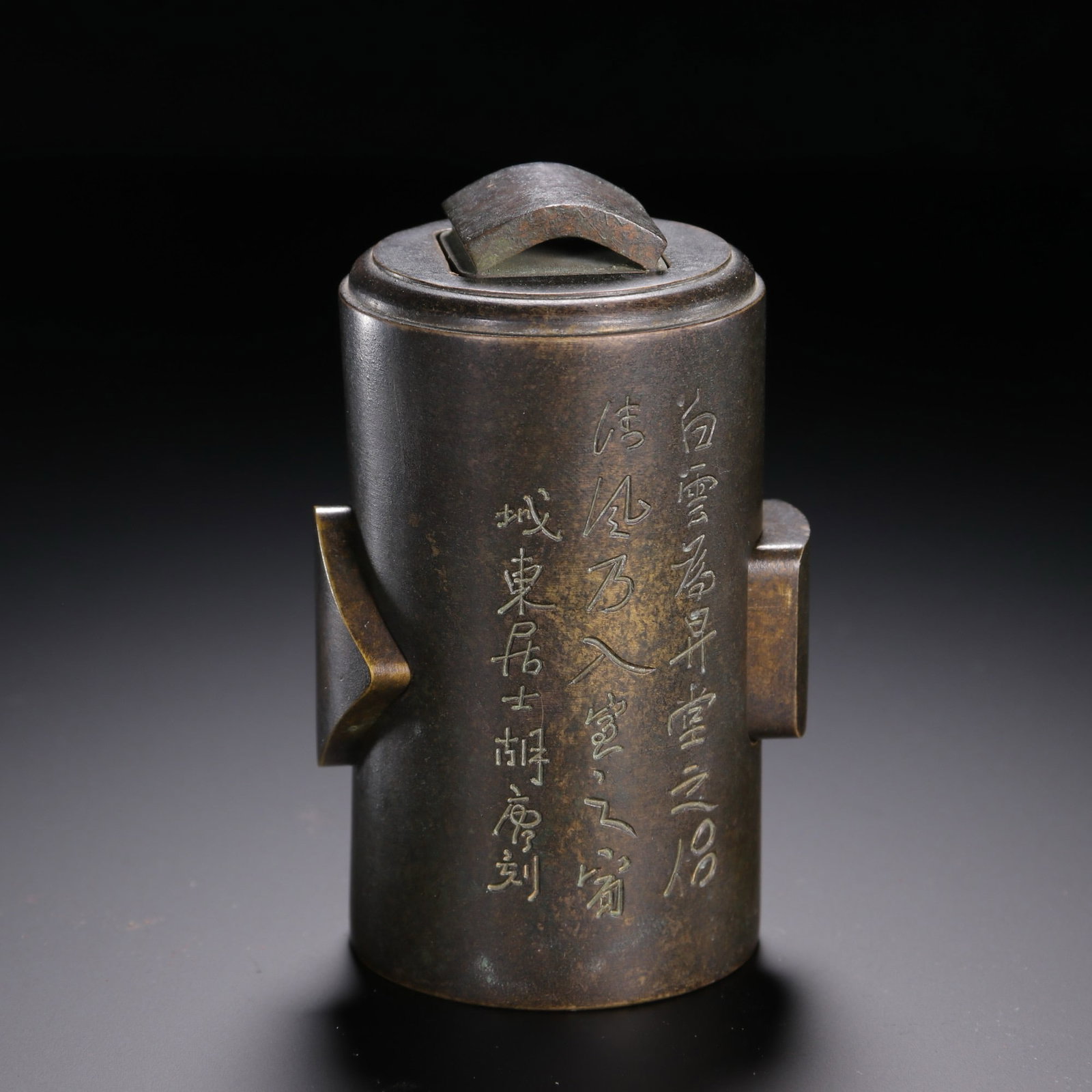 A CHINESE SET OF BRONZE SEALS: Standing 9.2 cm tall, 5 cm in width and weighing 1320 grams, this compact ensemble is housed inside a cylindrical bronze container boasting rich, naturally aged dark patina with subtle warm tonal high