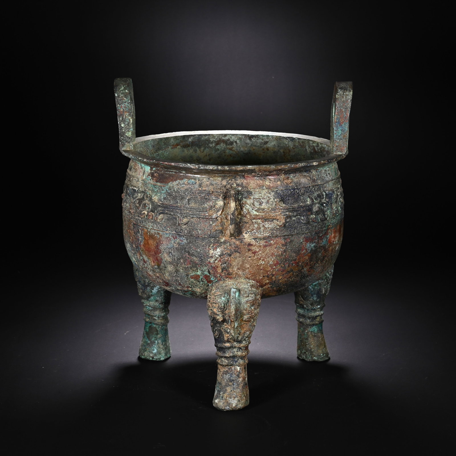 A CHINESE BRONZE DING VESSEL (1 of 9)