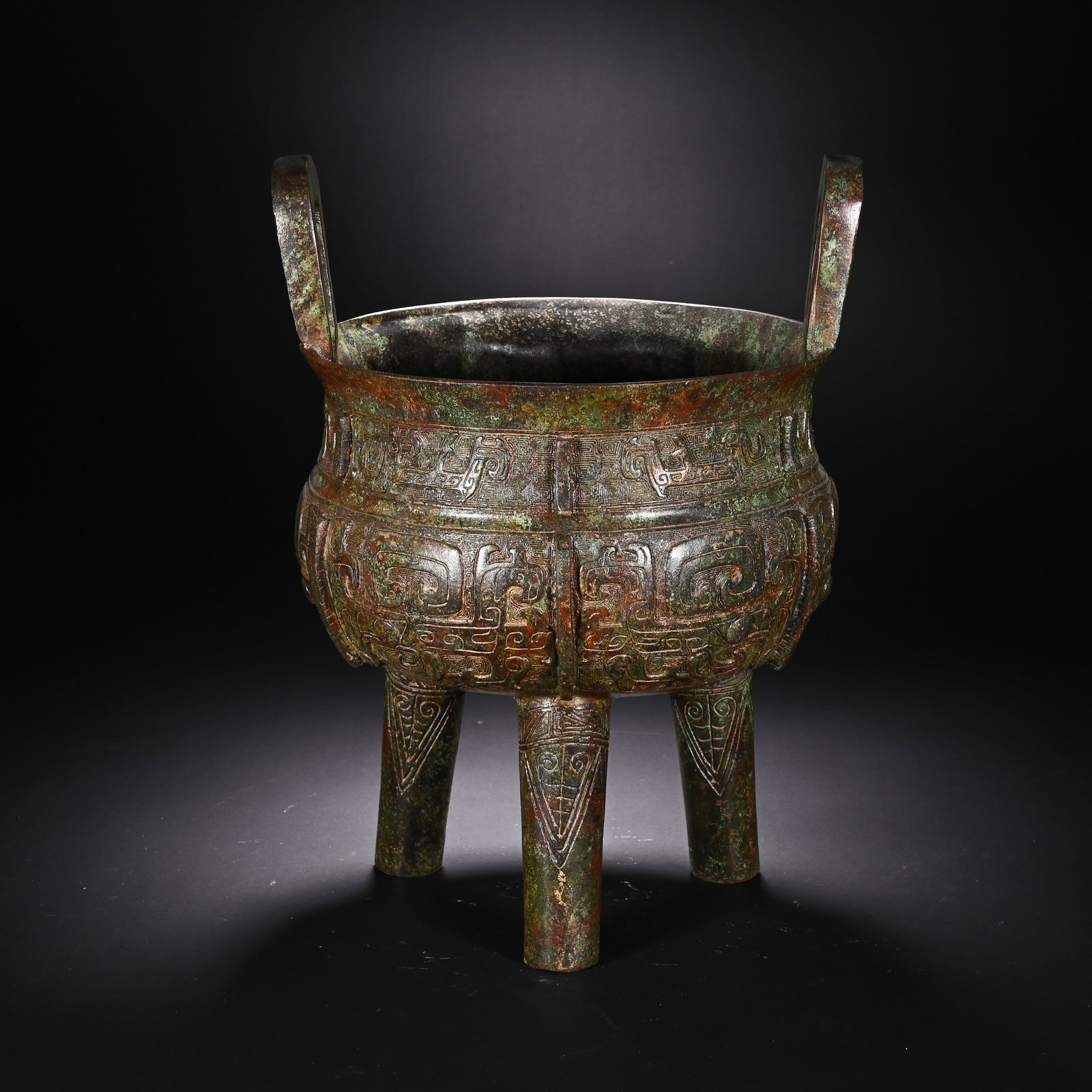 A CHINESE ARCHAIC BRONZE DING (1 of 9)