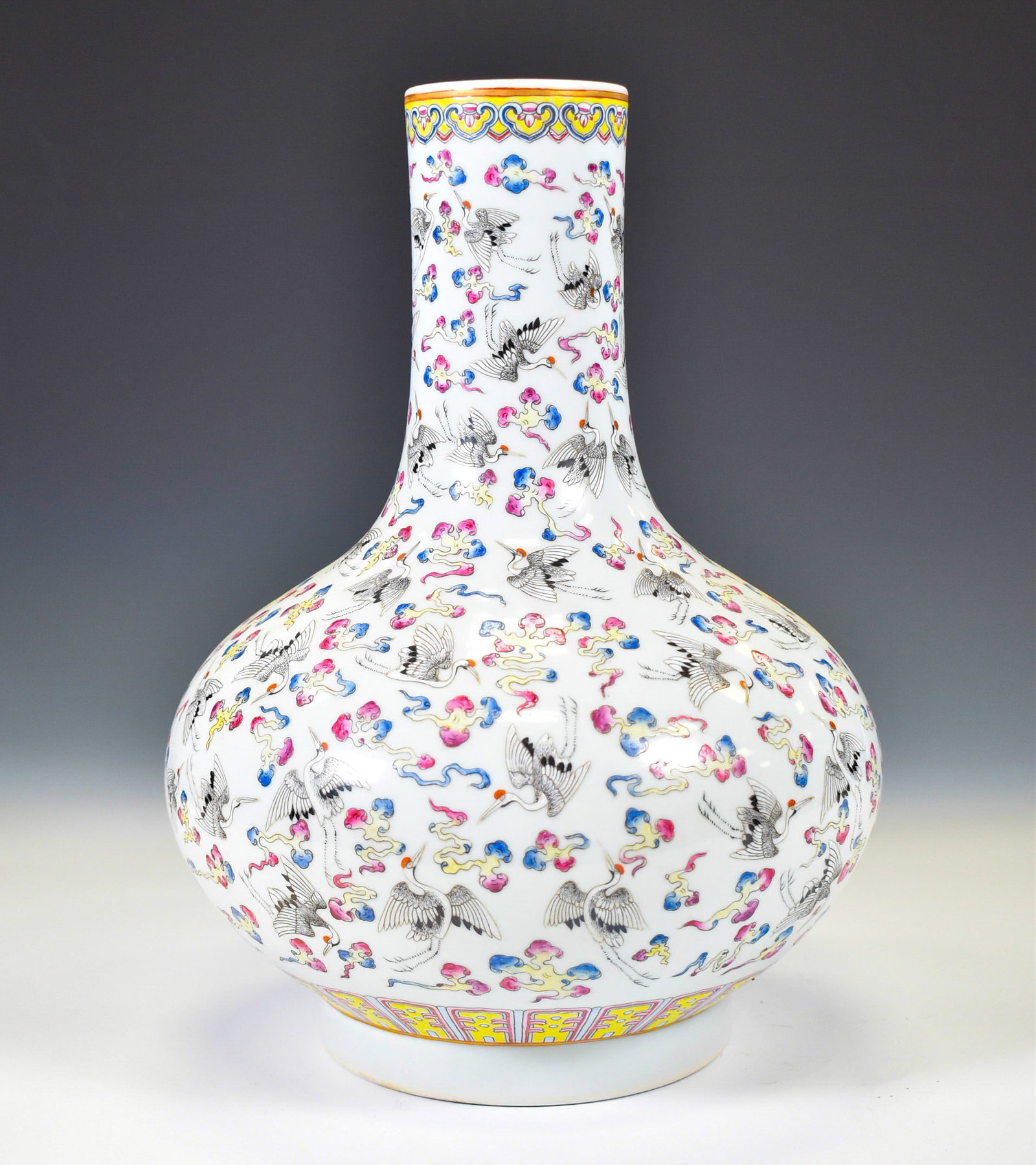 HUNDRED CRANES FAMILLE ROSE PORCELAIN VASE: Dimensions: 13"H x 8"W . Chinese Qing Dynasty Guangxu Famille Rose Thousand Cranes Motif Porcelain Bottle Vase. The Vase potted in celestial shape vase, thick and tall, globular lower body, cylindrica
