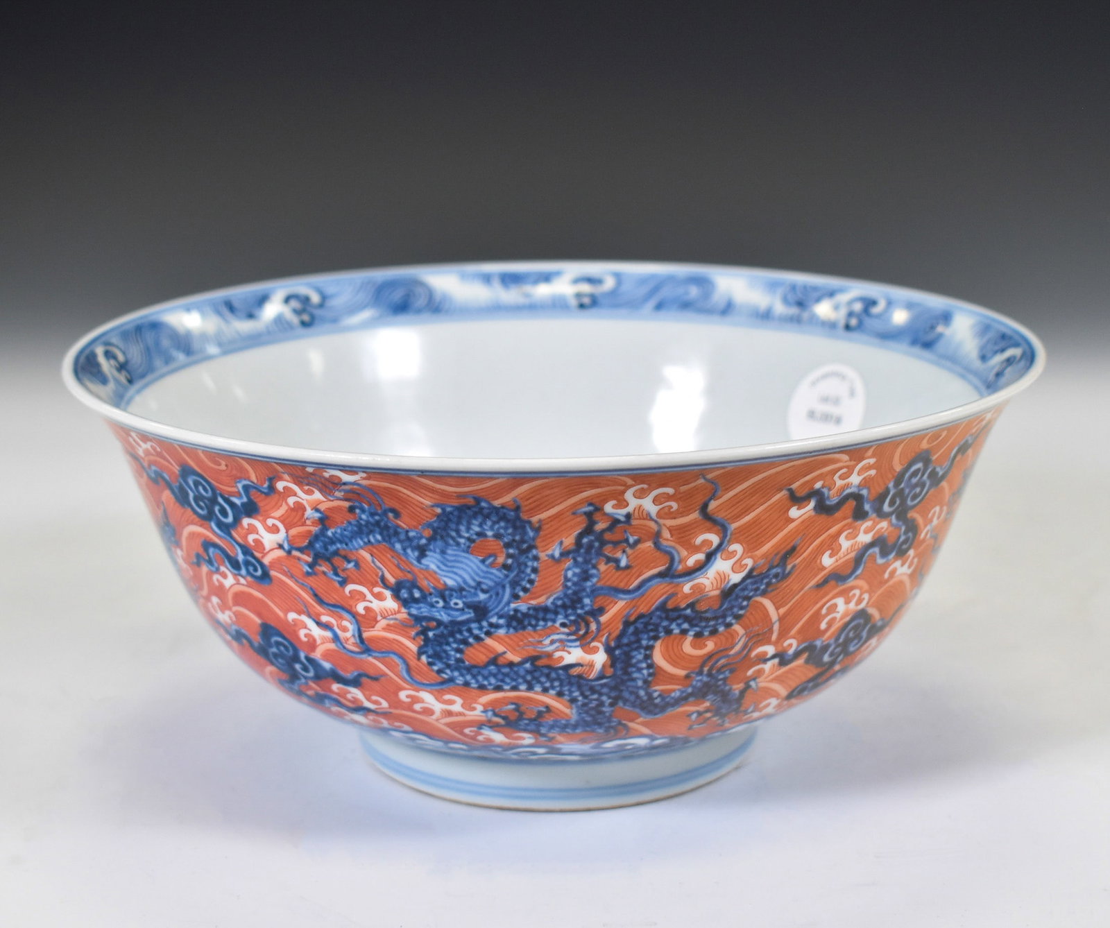XUANDE RED & BLUE DRAGON BOWL: Dimensions: 4"H x 7.5"W Chinese Ming Dynasty Xuande Blue white & Iron Red Dragon Motif Porcelain Bowls. The bowls has an open mouth, rounded lip rim, thick and large, deep arced body, raised with roun