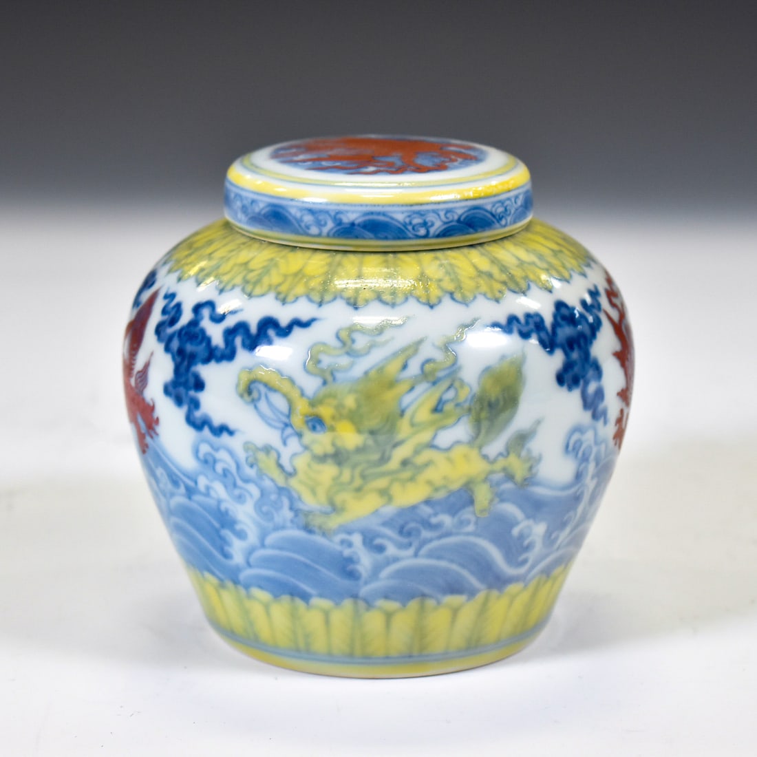 CHENGHUA DOUCAI LIDDED JAR: Dimensions: 4"W x 4"H Chinese Ming Dynasty ChengHua Doucai Mythical Beasts Porcelain Lidded Jar. Potted in jar shape, has an wide open mouth with a slightly out-turned lip, and the short neck leads to