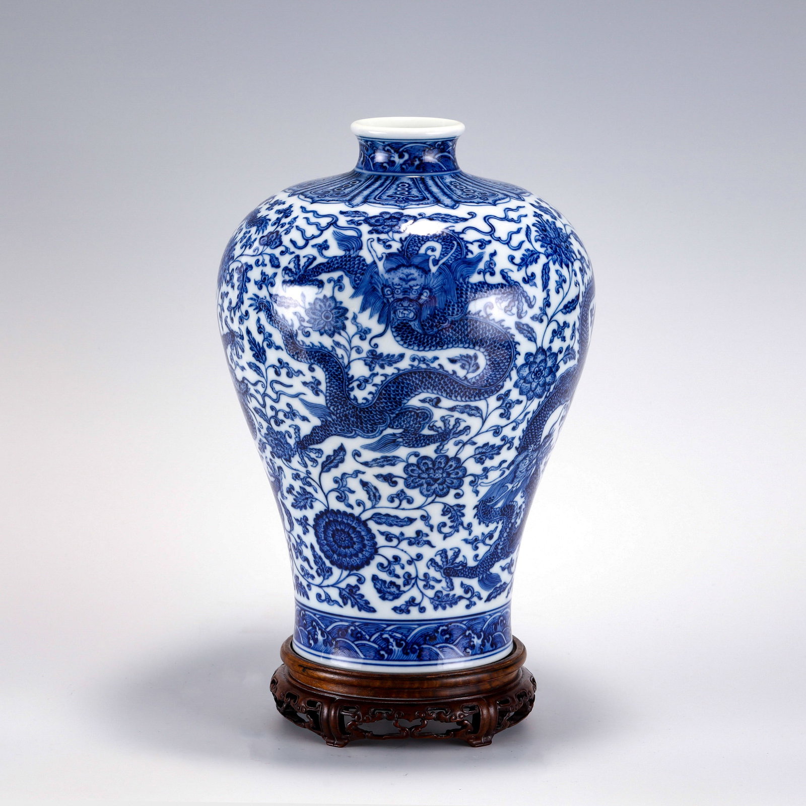 QING BLUE & WHITE MEIPING JAR ON STAND: PROVENANCE: From waldorf, MD Private Collector. Dimensons: Height: 35.2 cm, Diam: 25 cm Chinese Qing Dynasty Qianlong Blue and White Porcelain Plum Bottle Vase On Carved Hardwood Stand. The porcelain 