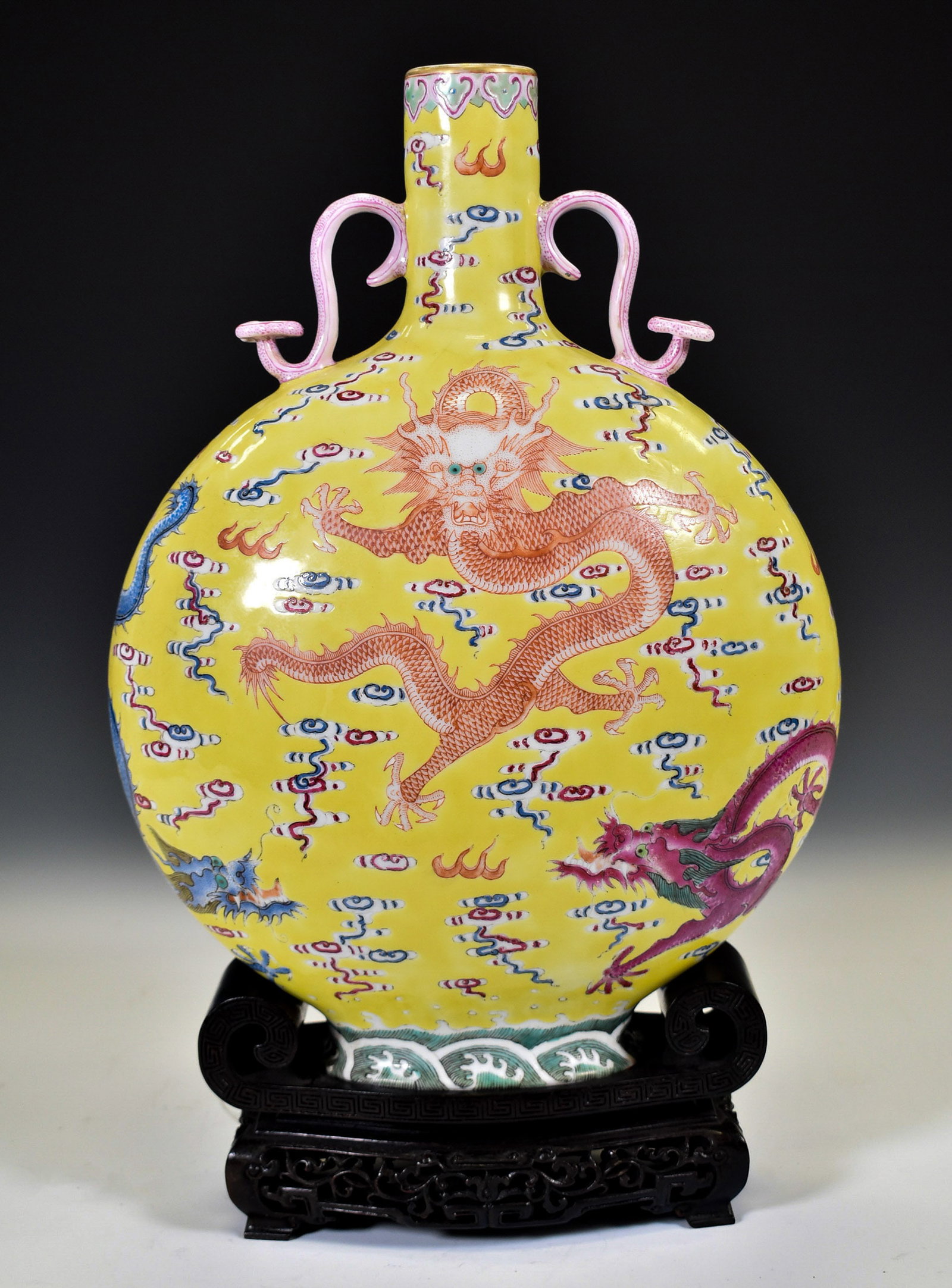 IMPERIAL YELLOW RED DRAGON MOON VASE W STAND: Dimensions: 14"H x 10.5"W Chinese Qing Dynasty Qianlong Emperor Reign period Dragon porcelain moon vase on carved hardwood stand. Thick potted vase of tapered compressed globular body, tapered gracefu