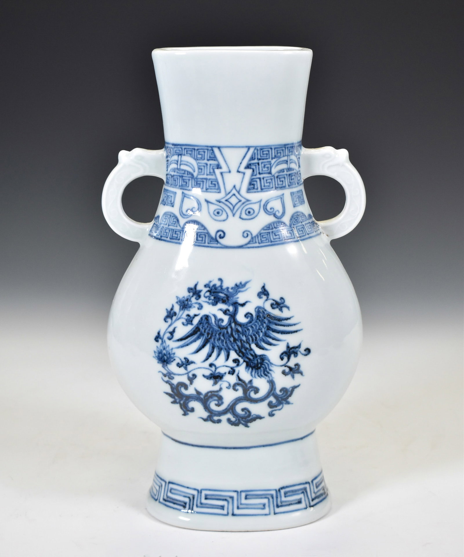 BLUE & WHITE PHOENIX MEDALLION ZUN VASE: Dimensions: 11.4"H x 6.5"W Chinese Ming Blue and White Phoenix Medallion Porcelain Zun Vase. Sturdily potted with a full rounded body rising to a waisted, slightly flared cylindrical neck, flanked by 