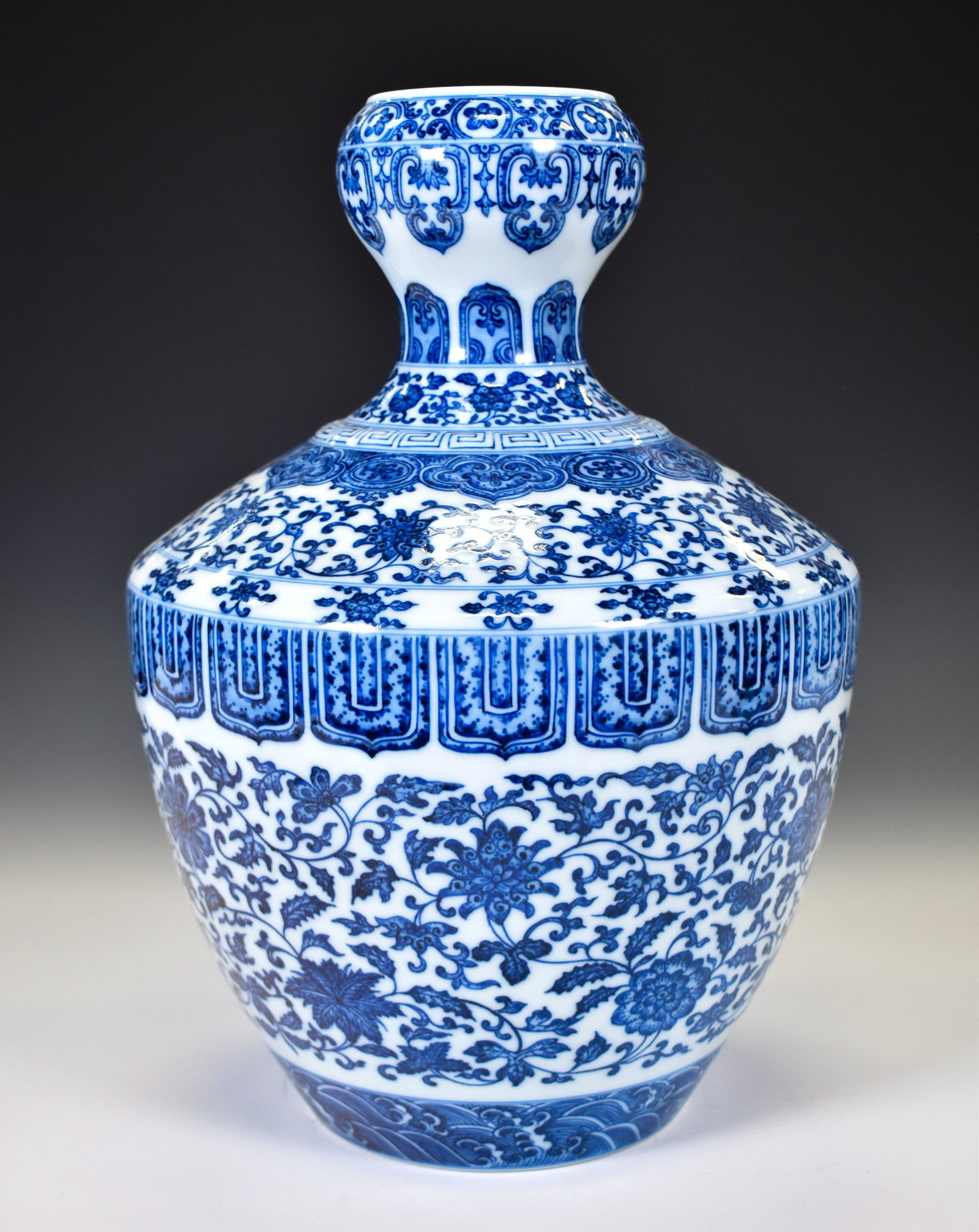 QIANLONG BLUE & WHITE WRAPPED FLORAL ZUN VASE (1 of 4)