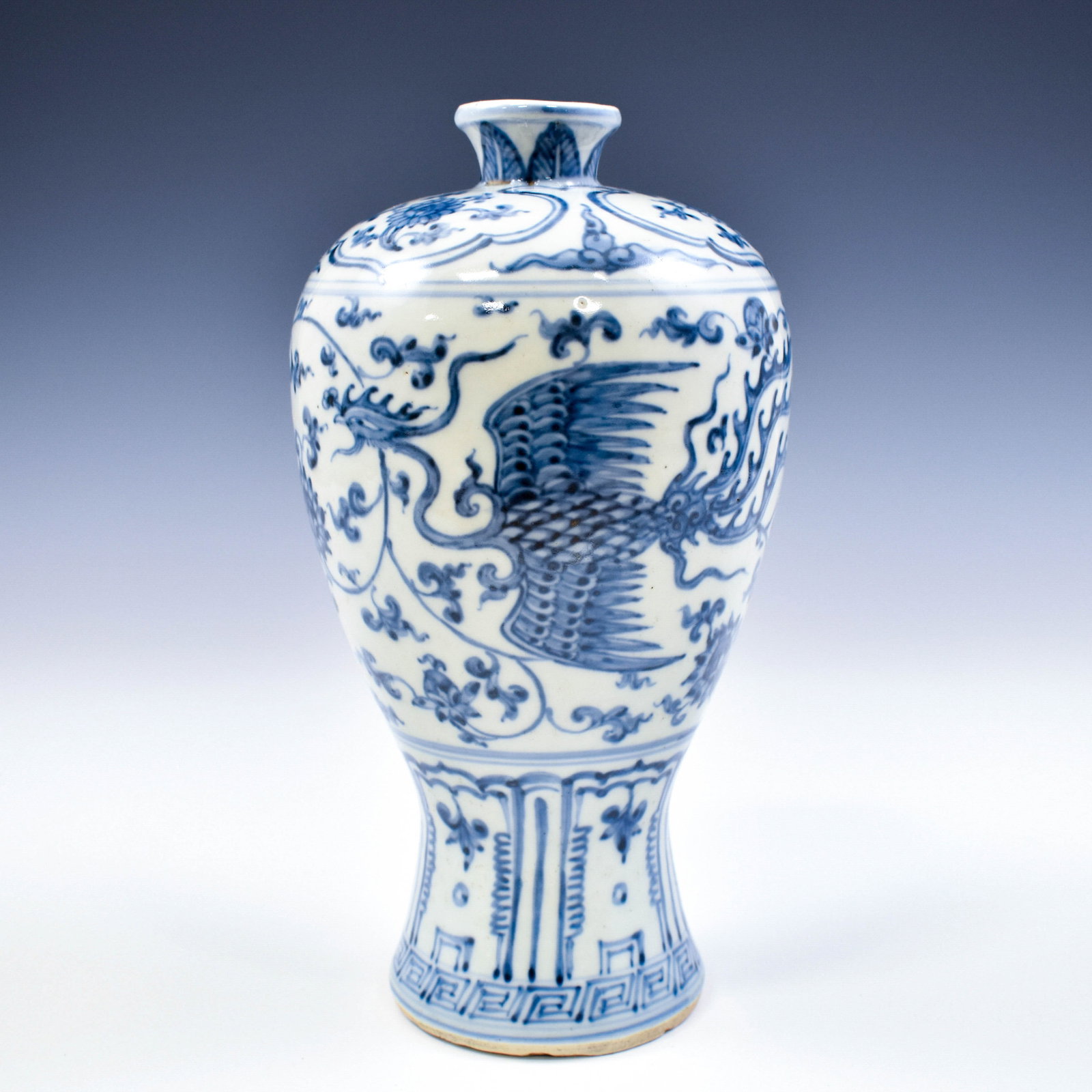 MING BLUE & WHITE DRAGON PHOENIX MEIPING VASE: Dimensons: 9-1/2" H x 5-1/4" Diam. The porcelain shaped into a traditional Meiping form vase, with a narrow base, wide body, slender neck easing to form a petite opening. The exterior decorated with h