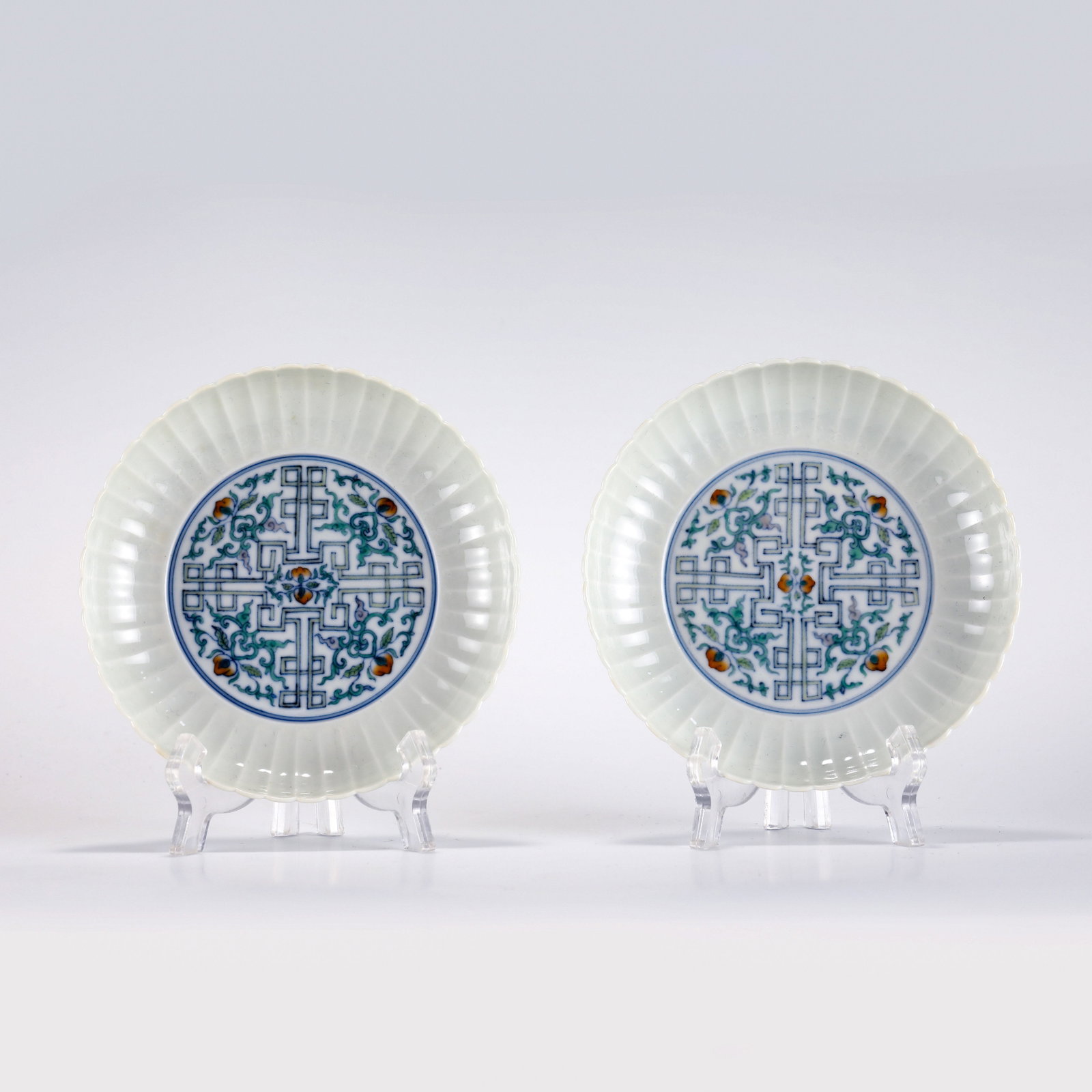 QING BLUE AND WHITE PRISMATIC PLATES: Dimensions: Height: 3.1 cm, Diameter: 15 cm Pair of Chinese Qing Dynasty Qianlong Blue and White Wanzi Porcelain Plates. The plate has a broad wide central interior, thick and round mouth lip, raised 