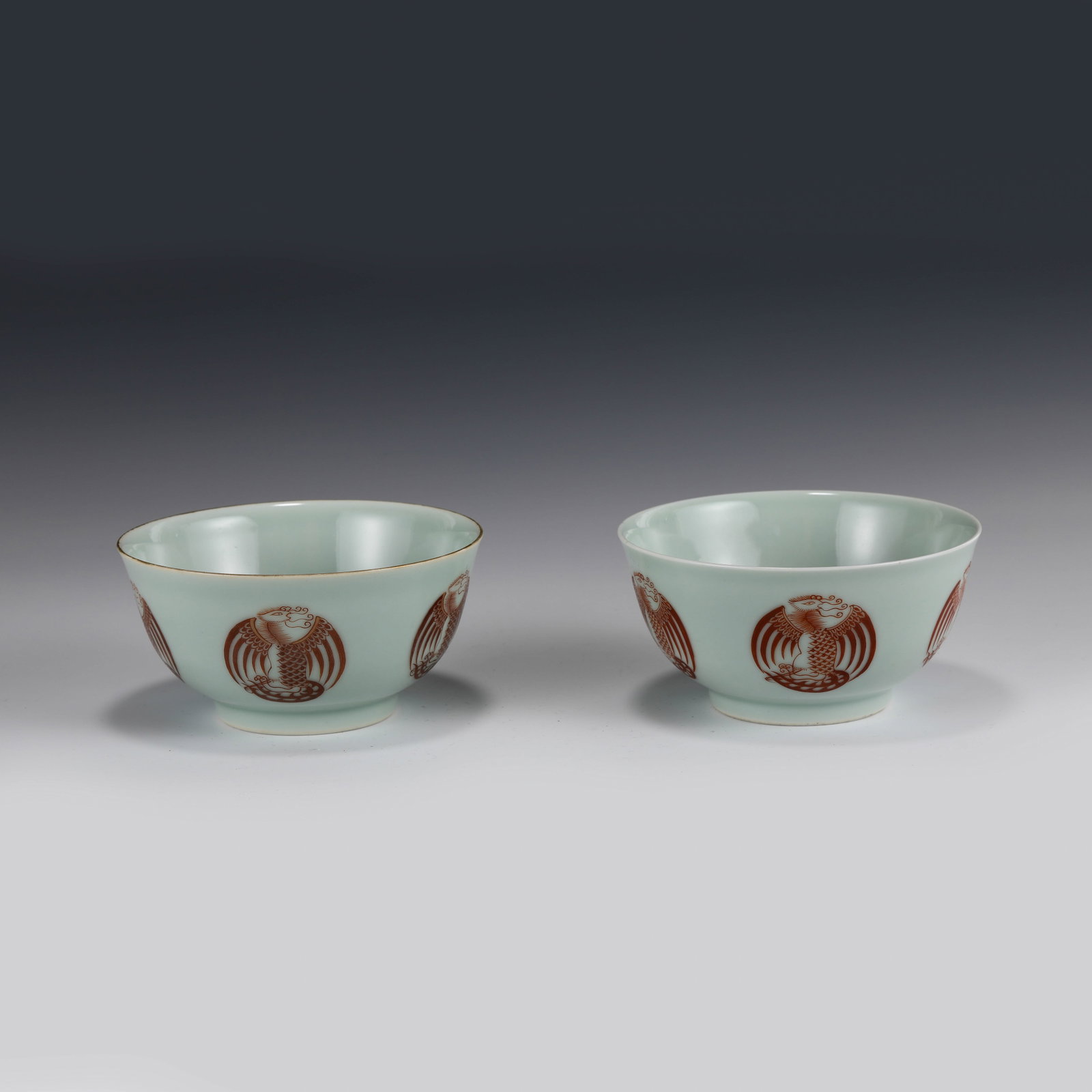 PAIR DOUQING IRON RED MYTHICAL BEAST MOTIF BOWLS: Dimensions: in (cm) Height: 7.5 Diameter: 15 Pair of Chinese Qing Dynasty Period Douqing iron Red Mythical Beast Motif Bowls. Potted with a shallow body, slight deep, thick and bulbous body, with angl