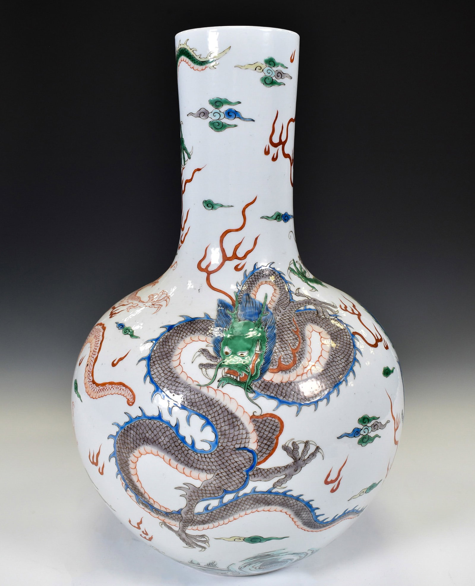 KANGXI FAMILLE VERTE DRAGON VASE: Chinese Qing Dynasty Kangxi Famille Rose Dragon Porcelain Celestial Vases. The porcelain potted in celestial shape vase, thick and tall, globular lower body, straight cylindrical neck, round mouth rim
