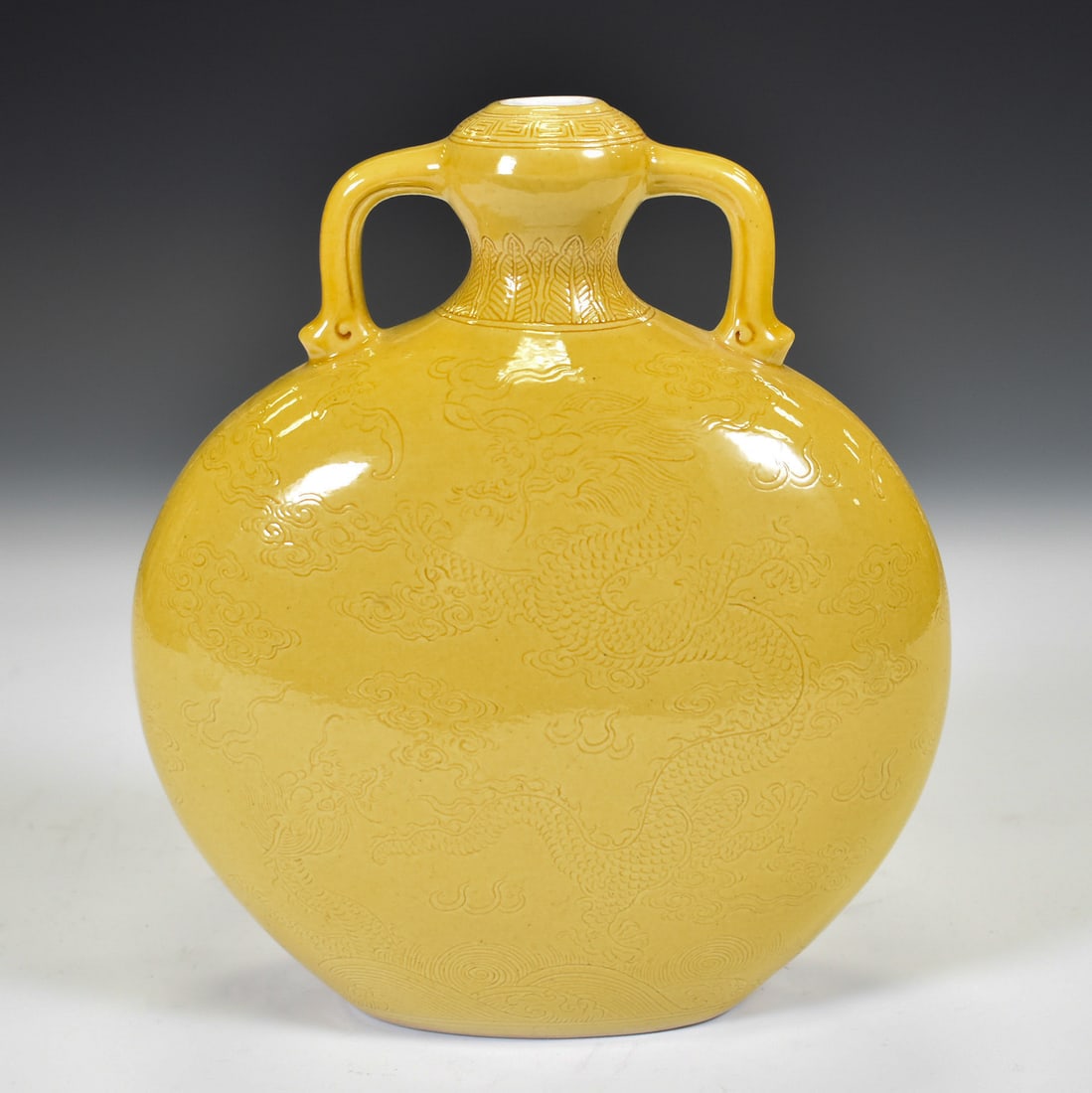 QIANLONG IMPERIAL YELLOW MONOCHROME MOON VASE: Dimensions: 8"H x 7"W . Chinese Qing Dynasty period, Famille Jaune Monochrome garlic moon vase. Potted in moon vase, thick and tall, with bulbous lower region, moon belly, sweeping up into a slender n
