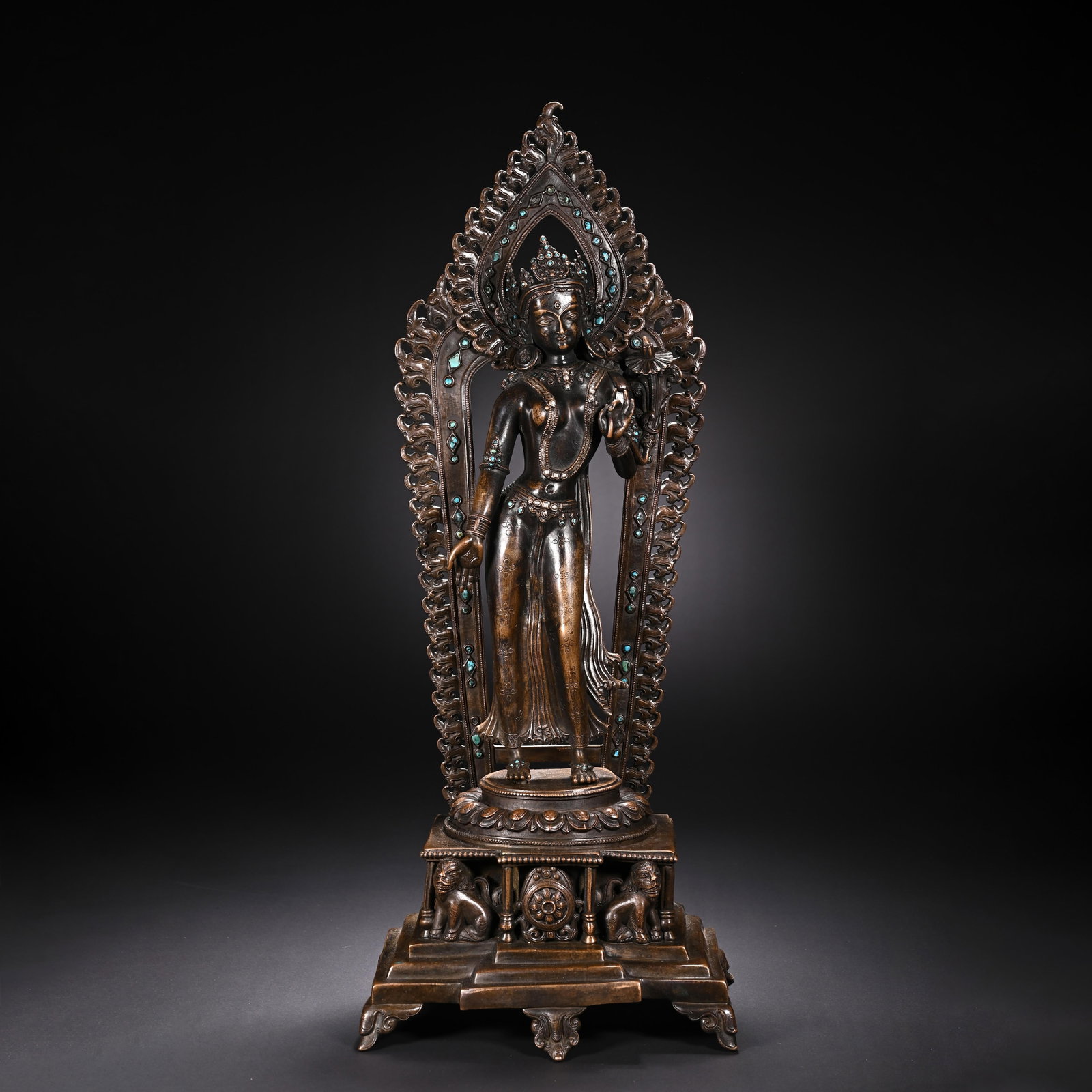 A CHINESE ALLOY COPPER BUDDHA STATUE: Standing 47 cm tall and 19 cm wide, this intricately cast alloy copper statue portrays an elegant standing bodhisattva adorned with delicate crown and finely rendered ornamental waist belts. An ornate
