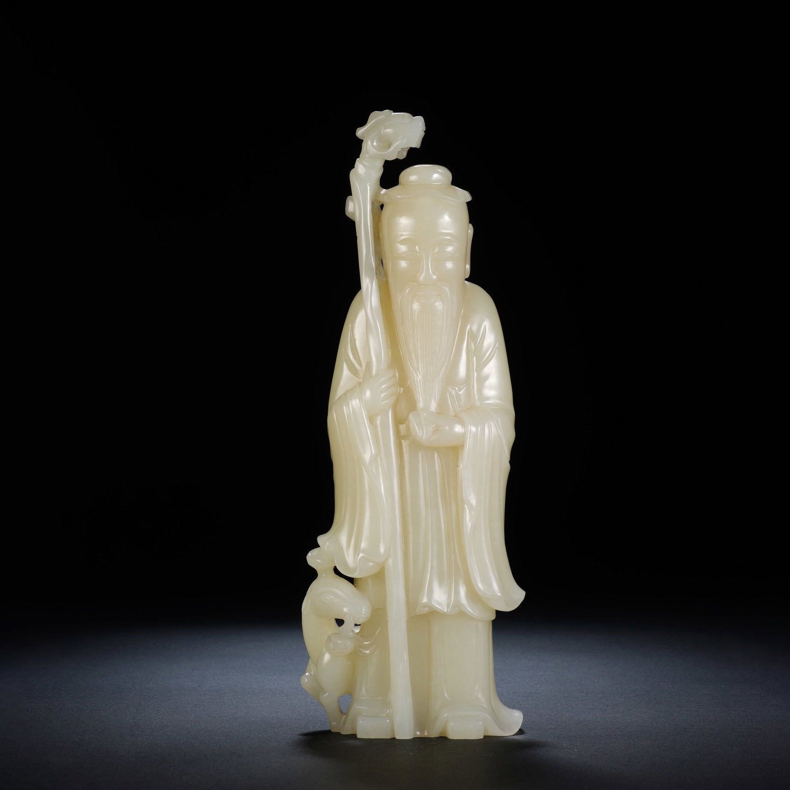 A CHINESE WHITE JADE SHOUXING STANDING FIGURE (1 of 12)