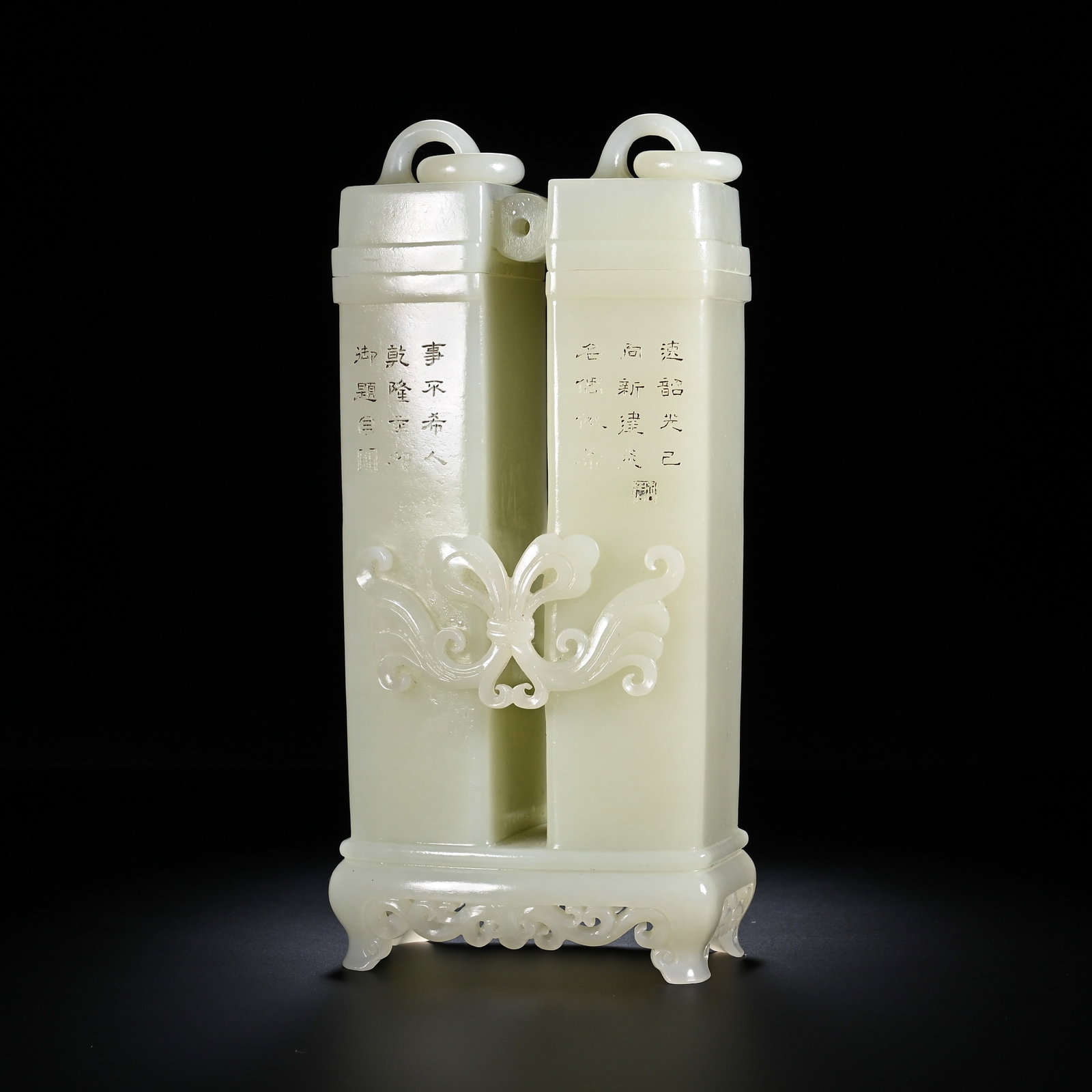 A CHINESE HETIAN JADE ORNAMENT: Measuring 17.8 cm in height and 8.5 cm in width, this refined desk ornament is carved from smooth creamy-white Hetian jade with a lustrous, even polish. It takes the inventive form of two joined uprig