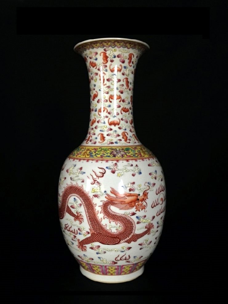 Late Qing Dynasty Chinese Famille Rose Porcelain Vase: Late Qing Dynasty, China, having body, enlonged neck with flared rim on footed base, glazed white ground featuring a highly detailed and fierce dragon in orange and gold. Mark on Base, 6 Blue Characte