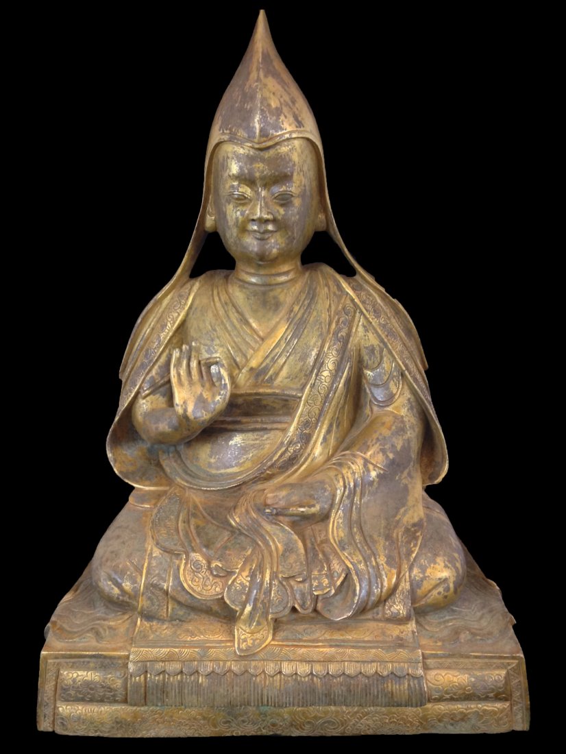 Large Antique Chinese Gilt Bronze Lama Buddha: Tibetian Lama Buddha deities, The Lama is seated in a dhyanasana on top of pedestal throne, wearing traditional Tibetan long robe with a pointed hat, with both hands in abhaya mutra; Caligraphy ensrci