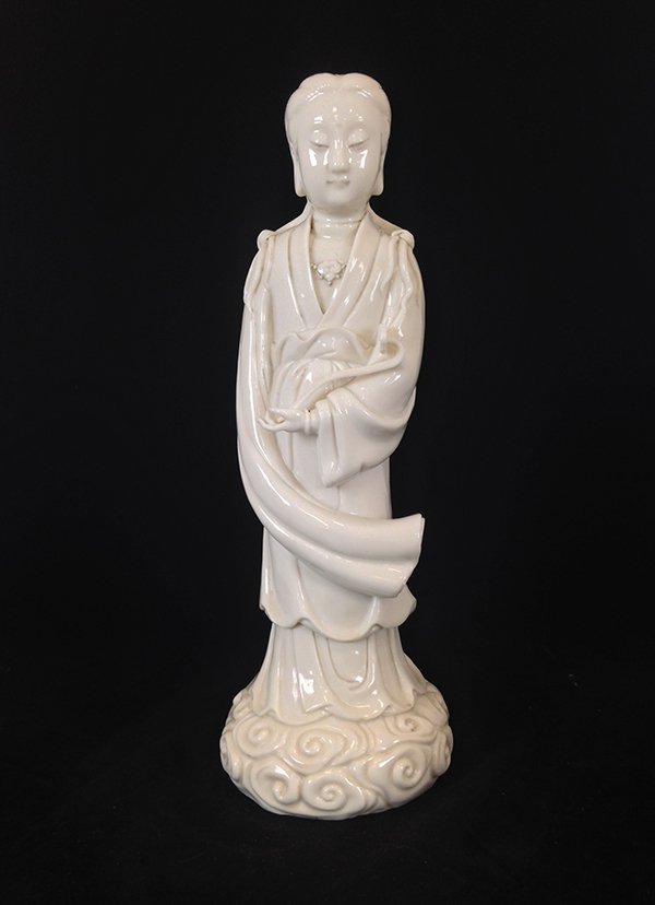 19th C Chinese Blanc De Chine GuanYin Porcelain Figure: Chinese 19th C., Blanc de Chine - White glazed Guanyin, standing figure holding a ruyi scepter, wearing long flowing robes, with serene looking seen on the face. Mark on reserve. Measure: 12 5/8" Heig