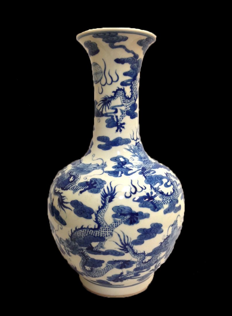 Chinese Blue and White Imperial Dragon Porcelain Vase: China, blue and white vase with bulbous body, a flared lip and footed base, painted with a repeating pattern of imperial five toeds dragons amidst stylized clouds. Mark on Base, 6 Blue Characters, Gua