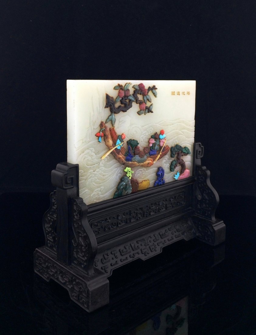 A FINE COLORFUL INLAID JADE TABLE SCREEN: Chinese Colorful Inlaid Jade Table Screen. Vividly colorful decorated with semi-precious stone inlaid depicted figures with abundance on a raft rowing by a river. Showing the Longevity peach tree and 