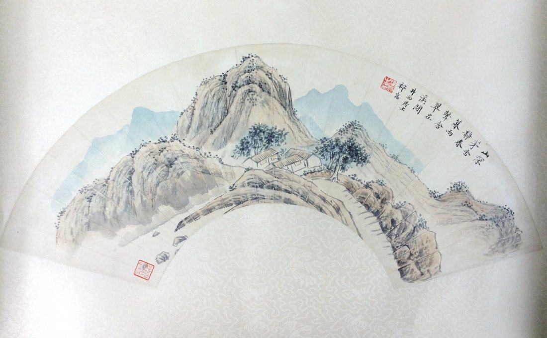 CHINESE FAN SHANSHUI PAINTING: Chinese Fan Painting, watercolor on paper in a fan shape with silk border, hand painting depicted misty mountain with water side scene, showing calligraphy inscription followed by iron red signature s