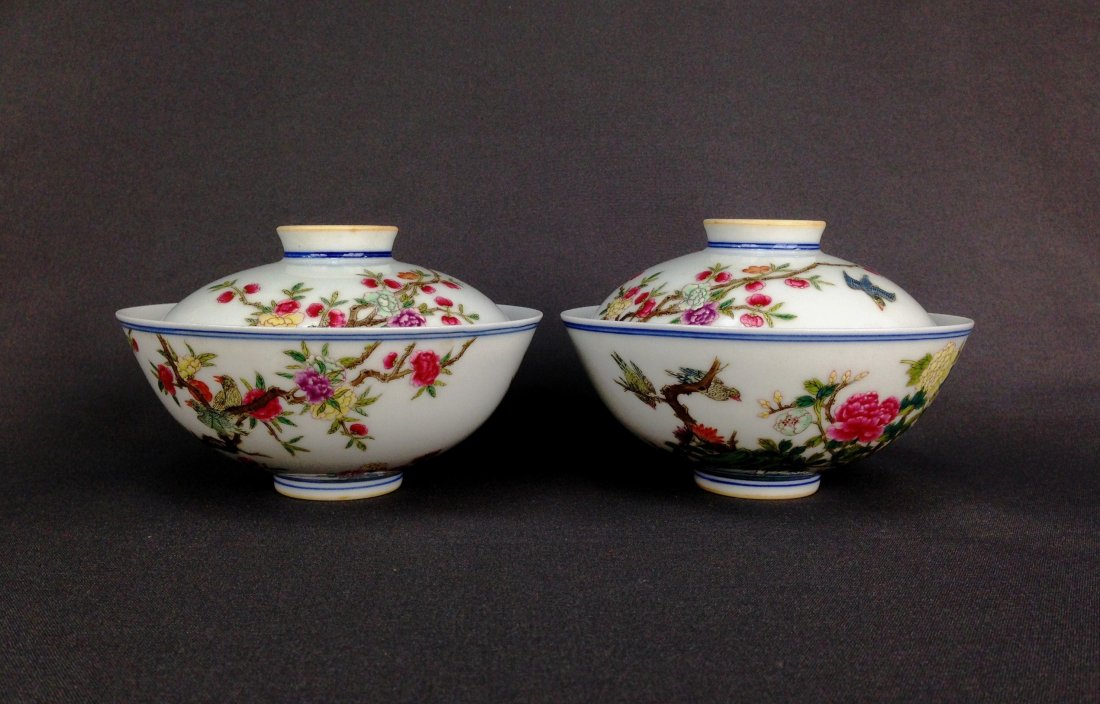 PAIR OF FAMILLE ROSE COVERED TEA CUPS: Pair of Chinese Famille Rose Covered Tea Cups. The diameter of the lid was less than that of the bowl. The lid would in other words fit into the bowl. Both Part adorned with hand painting of plum blos