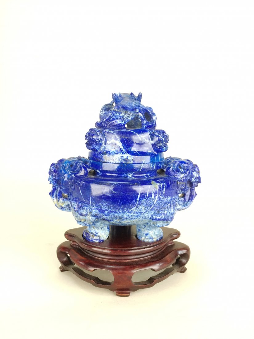 FINE CARVED LAPIS LAZULI CENSER W/ STAND: Globular body with domed lid, Ornate two piece censor with claw feet, carved Foo lion faces on handles. Carved wrapped dragon handle on hardwood stand. Size, 7.75 (including stand) Dimension: 205mm H 