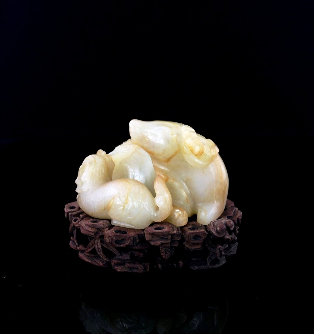 A VERY FINE CARVED JADE OF OXEN, 18th/19th C.: The well carved fine jade recumbent a motherhood relation of Ox and calf, 18th/19th C. Smooth lustrous, and moist milky appearance, The even pale celadon stone has sporadic pale russet 'skin' and natu