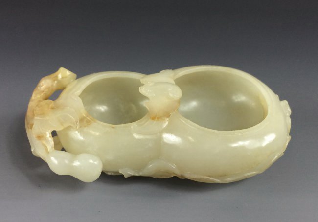 CARVED WHITE JADE OF DOUBLE GOURD BRUSH WASHER: Finely carved Chinese Jade of Double Gourd Brush Washer, in form of Double gourd with its bulbous body resembled the bowls, decorated with stem and branching leaves attached to the both end. Jade carv