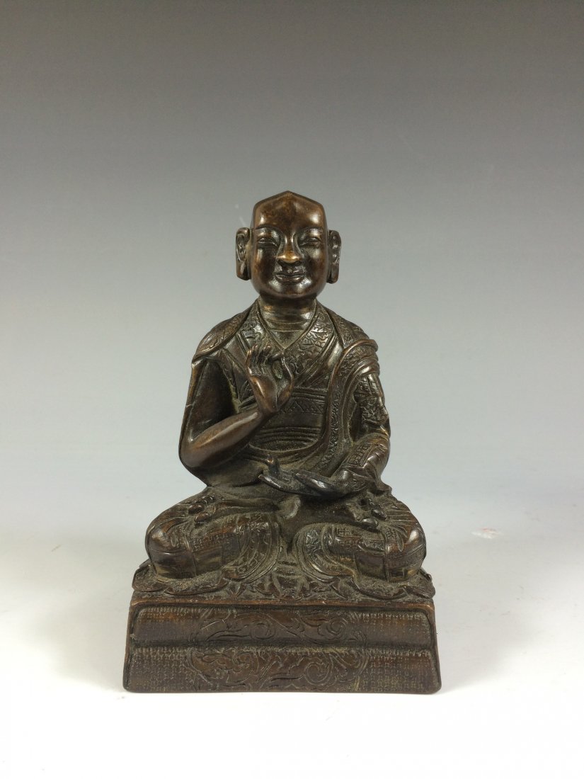 ANTIQUE BRONZE BUDDHA FIGURE OF MONK: China, Gilt bronze of Buddhist Monk figure, hand in Dhayana Mudra to the chest, seated in Lotus position on a rectangular pedestal throne. Measure: 5-3/4"H x 3-5/8"W Weight: 2.5 LB