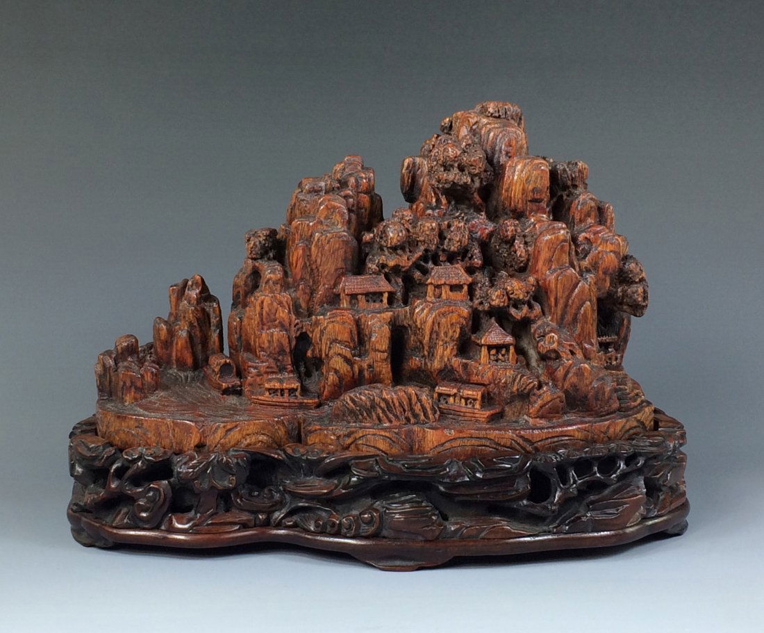 A CARVED CHENXIANG WOOD OF MOUNTAIN SCENERY: A Carved Chinese ChenXiang Wood Of Mountain Scenery. Condition Report: minor crack and chips, color distortion, consider normal due to ages and wear. Dimension: 5-3/4"H x 8-1/2"L Weight: 1.2 LB