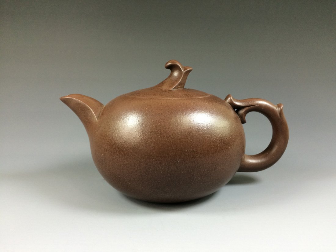 CHINESE YIXING ZISHA GLOBULAR TEAPOT: China, Yixing Zisha teapot, with Globular body, decorated with branching twigs flanked on shoulder and lid resembled handle and finial, showing double mark on base, inner lid, and handle. Measure: 3-3