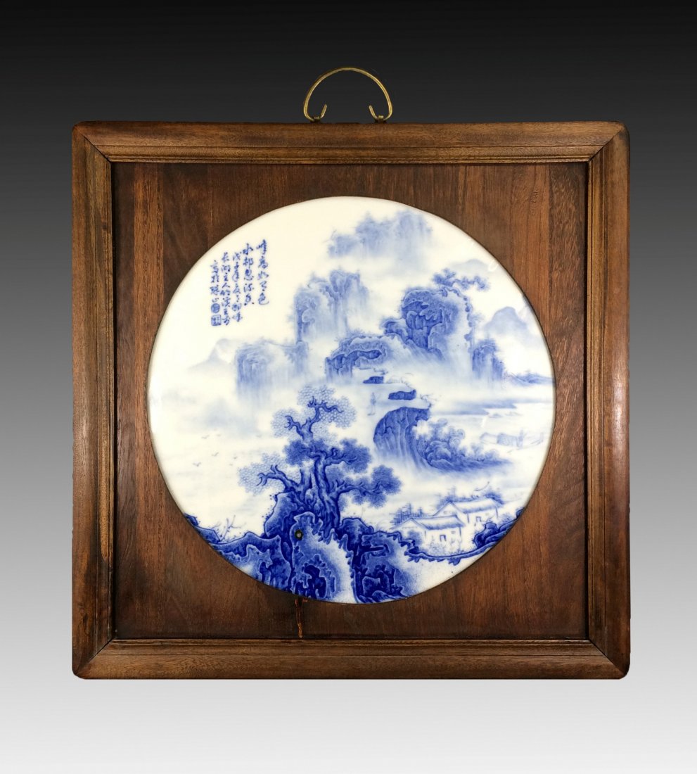 20th C. BLUE AND WHITE FRAMED ROUND PORCELAIN PAINTING: 20th C. Chinese Blue and White Framed Round Porcelain Painting Plaque. Of a round shaped plaque, hand painted with underglazed blue of misty mountain scene, showing characters title inscriptions follo