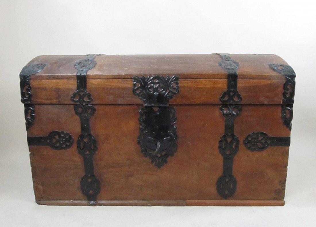 Old metal banded steamer trunk: Domed steamer trunk 47" wide 28" high 23" wide has lock and key.