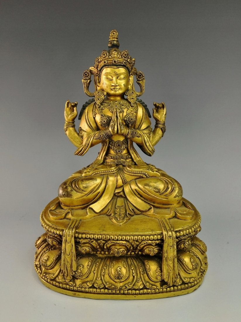 MING SEATED GILT BRONZE FOUR ARMS BUDDHA (1 of 8)