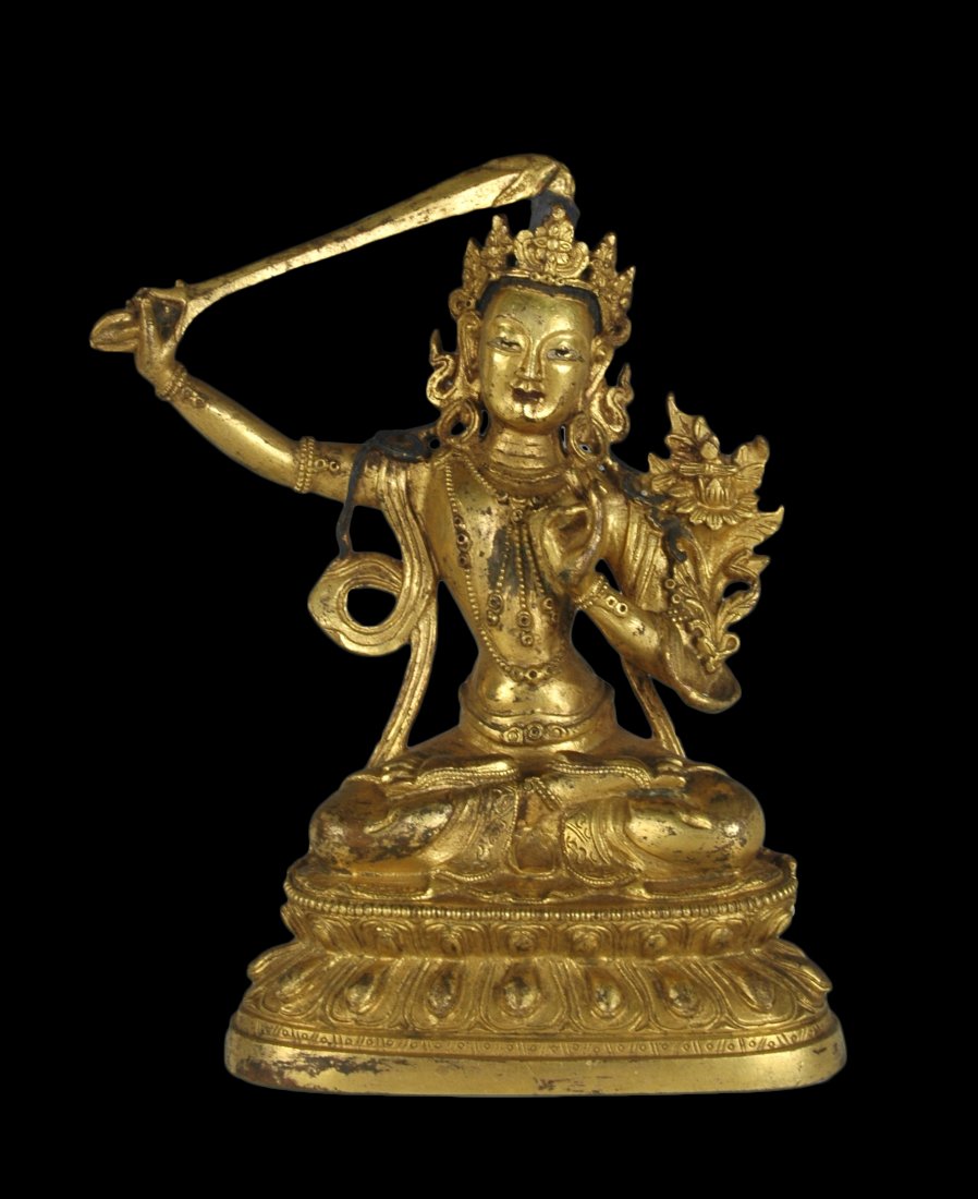 A MING GILT BRONZE BUDDHA FIGURE WITH A SWORD (1 of 8)