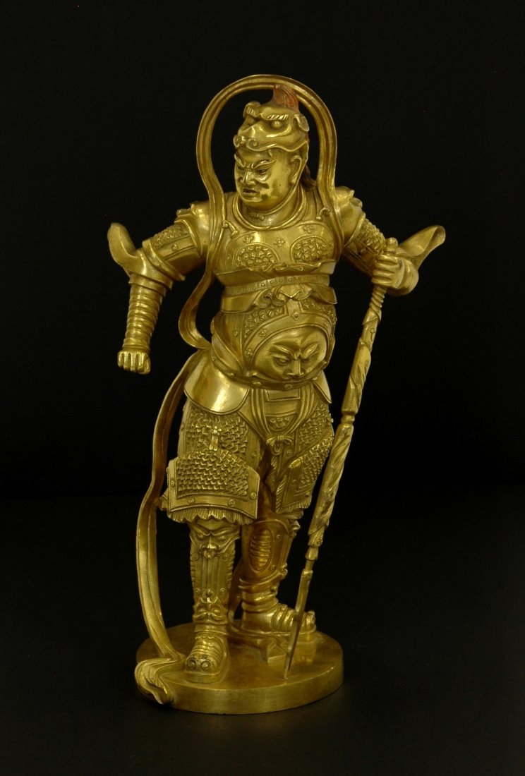 A GILT BRONZE IMMORTAL GUARDIAN FIGURE (1 of 9)