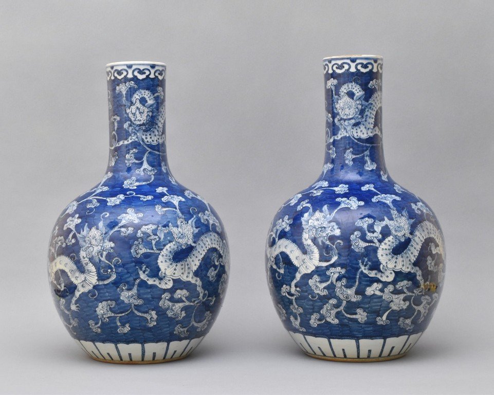 PAIR OF LARGE REVERSE COBALT BLUE UNDERGLAZED CELESTIAL: Pair of Large Ming Dynasty Cobalt blue reserved underglaze celestial porcelain vase. Of celestial shaped vase, globular body, tall neck to slightly flared rim, with concave footed base. The exterior d