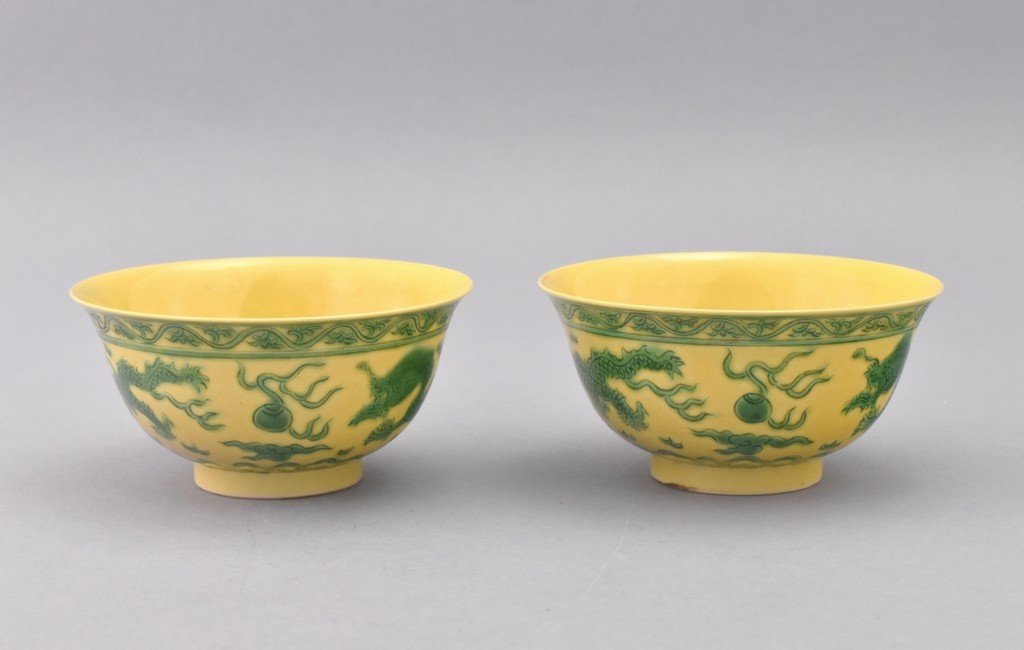 PAIR OF FAMILLE VERTE DRAGONS BOWLS: Finely potted deep vessel body, slightly flared rim, raised upon a concave footed ring base. The exterior decorated with jade-green hand painting enormous dragons in pursuit of flaming pearl. Bordered