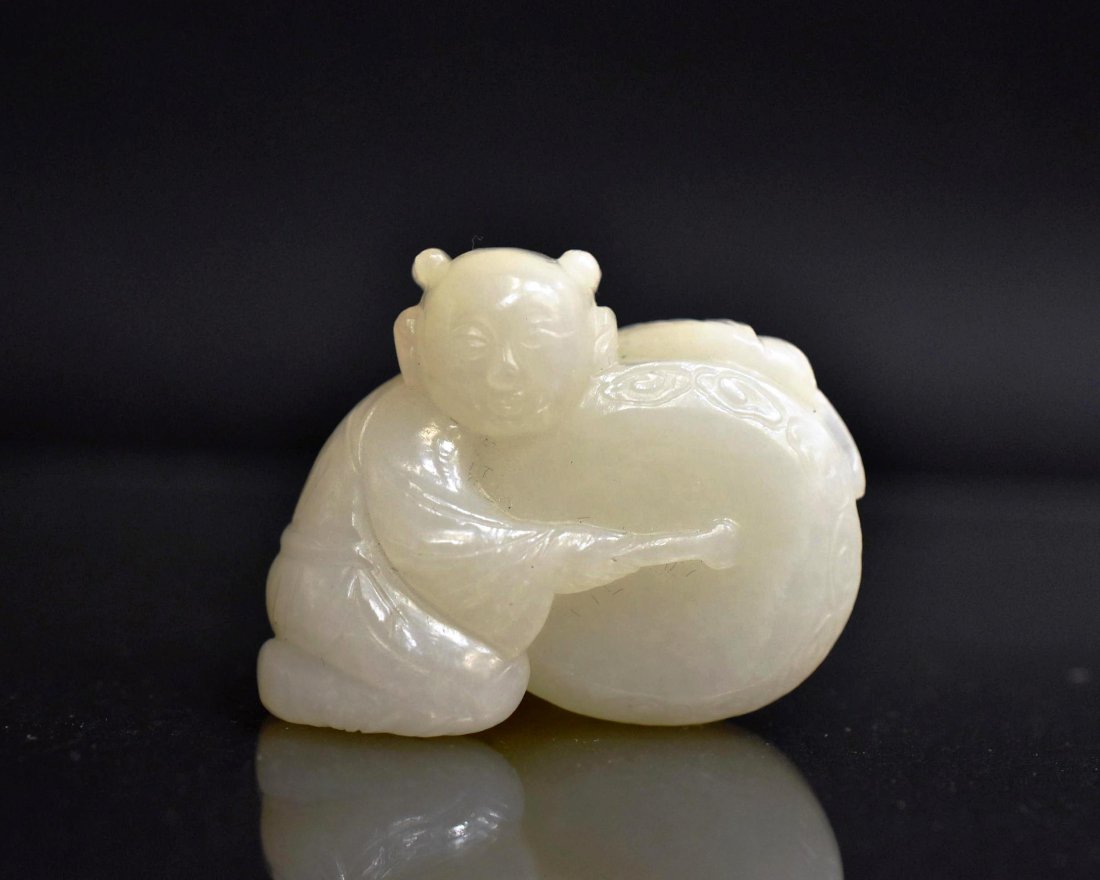 CARVED WHITE JADE IN SHAPE OF BOY WITH DRUM (1 of 7)