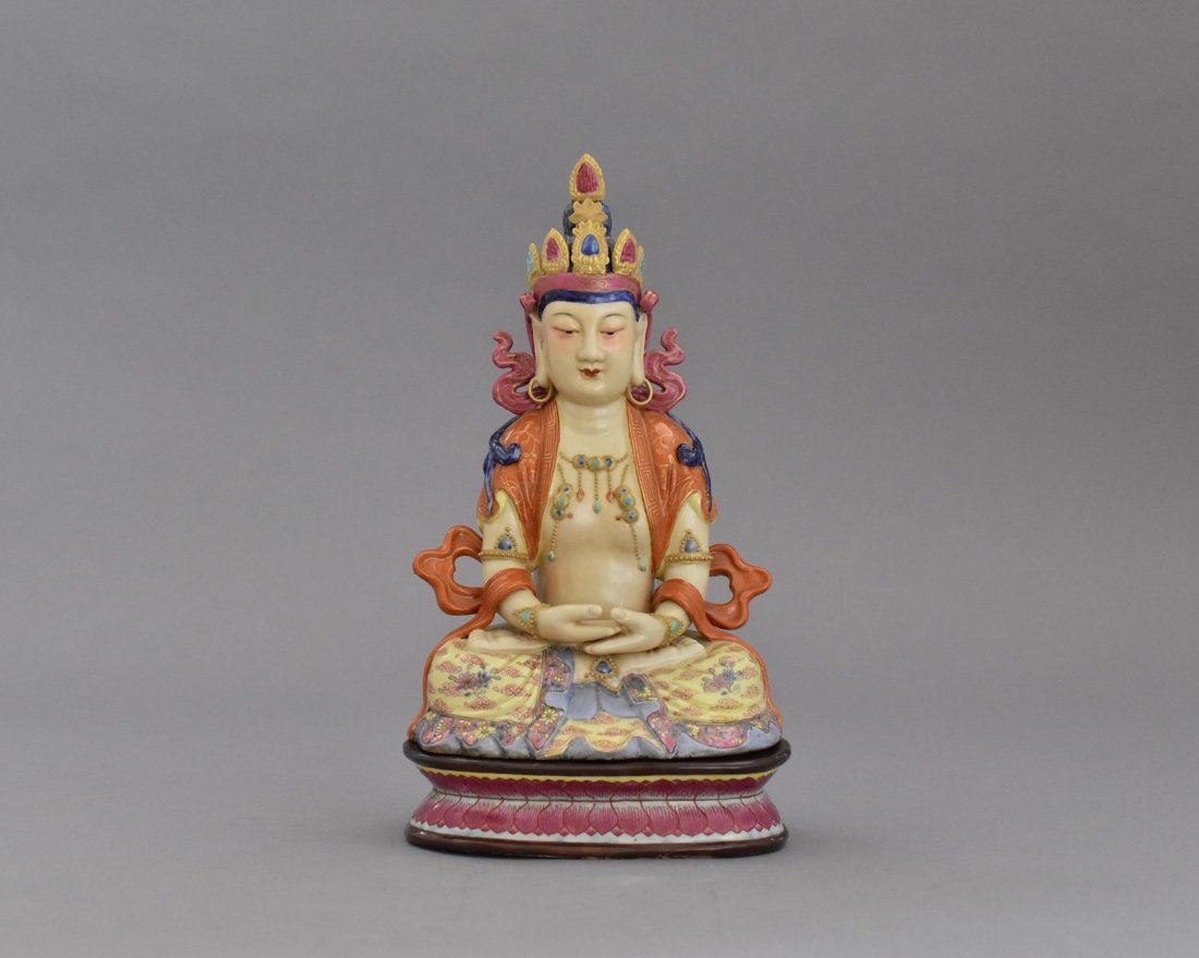 VERY FINE FAMILLE ROSE PORCELAIN SEATED BUDDHA: In form of seated Buddha with both hand in Dhayana Mudra, gesture of balance meditation, seated in full lotus position upon a throne pedestal, wearing robe open to chest, elongated ears below the curl