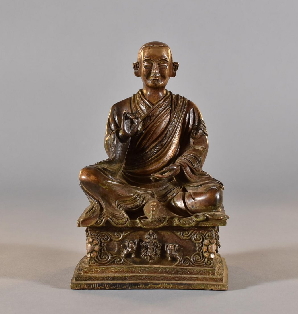 A CHINESE GILT BRONZE MONK STATUE (1 of 8)