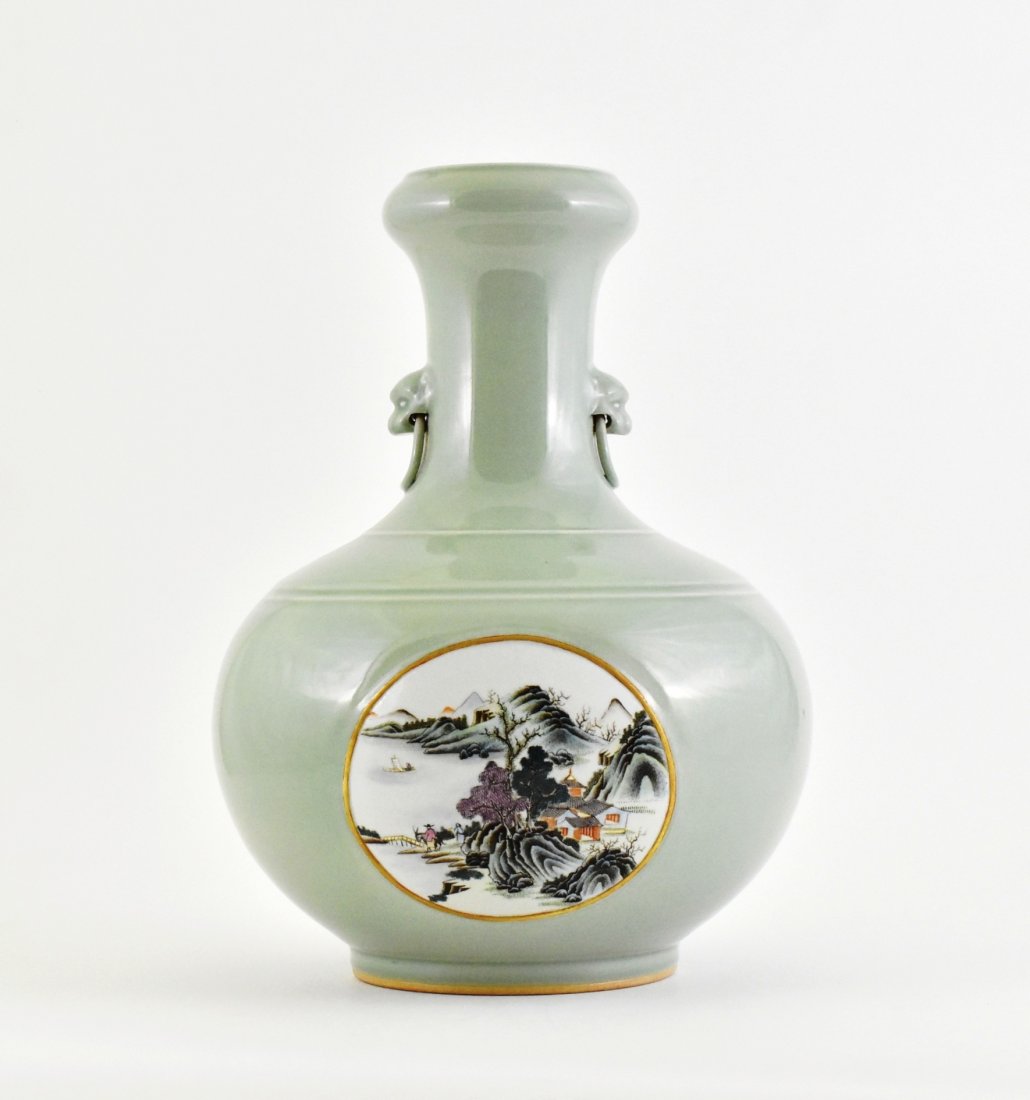 CELADON GLAZED CELESTIAL GARLIC VASE WITH PANORAMIC: The large vessel having a globular body, rounded shoulder surmounted the tall neck further to bulbous rim, raised upon slightly concave footed base. Two lion masks flanked above the collar holding rin